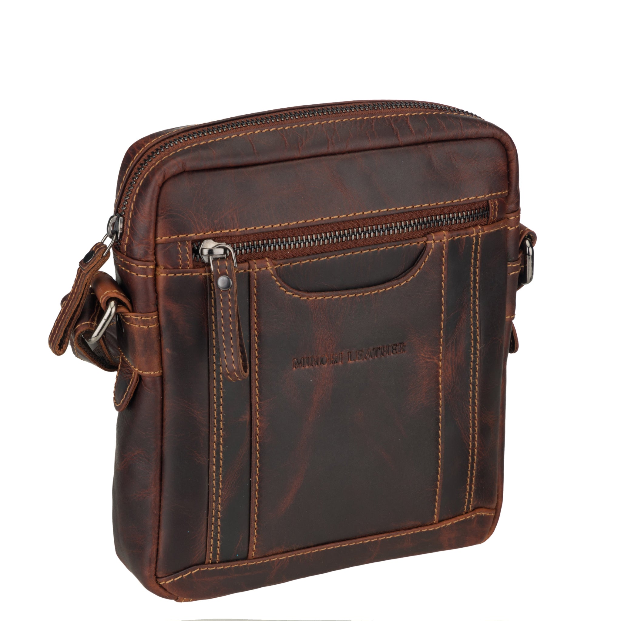 Angled view of Brown Minori leather crossbody bag on a white background
