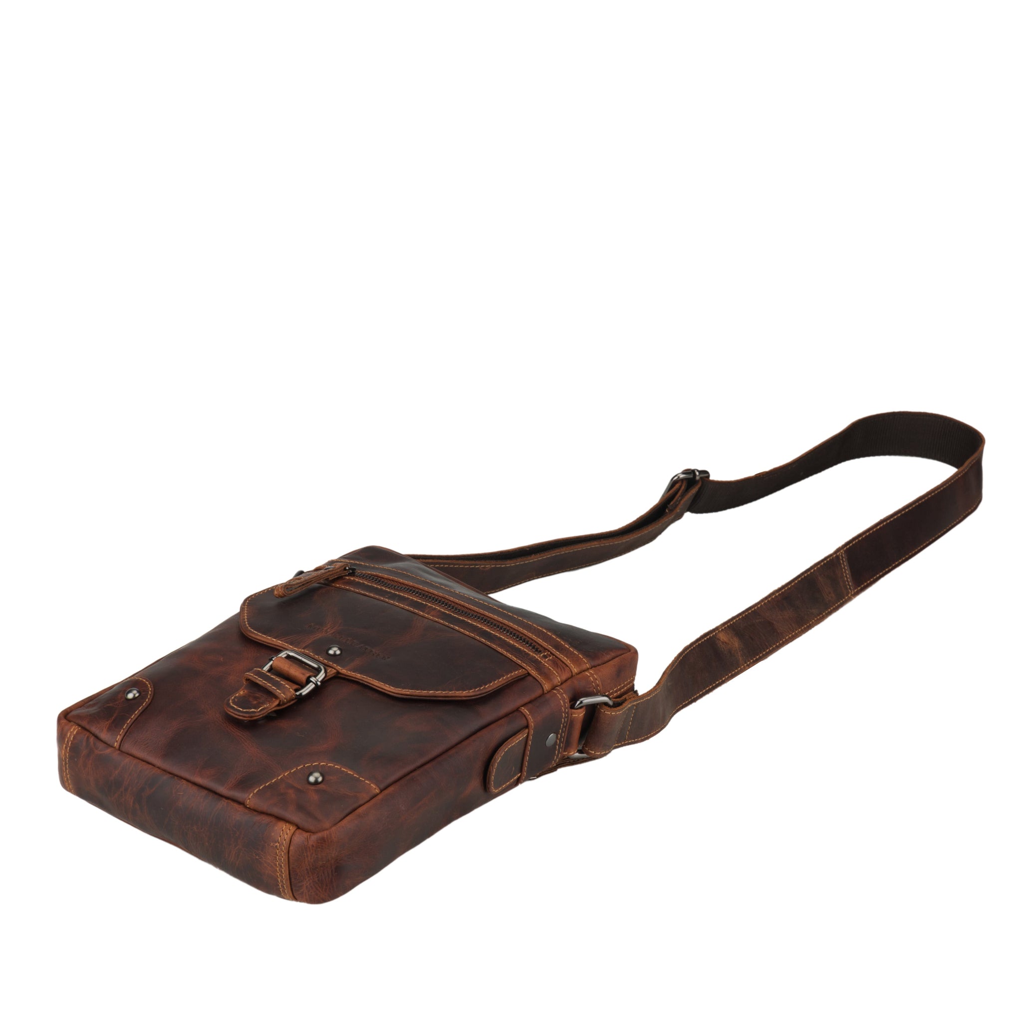 Side profile of a brown Minori leather crossbody bag laid flat with visible strap and hardware.