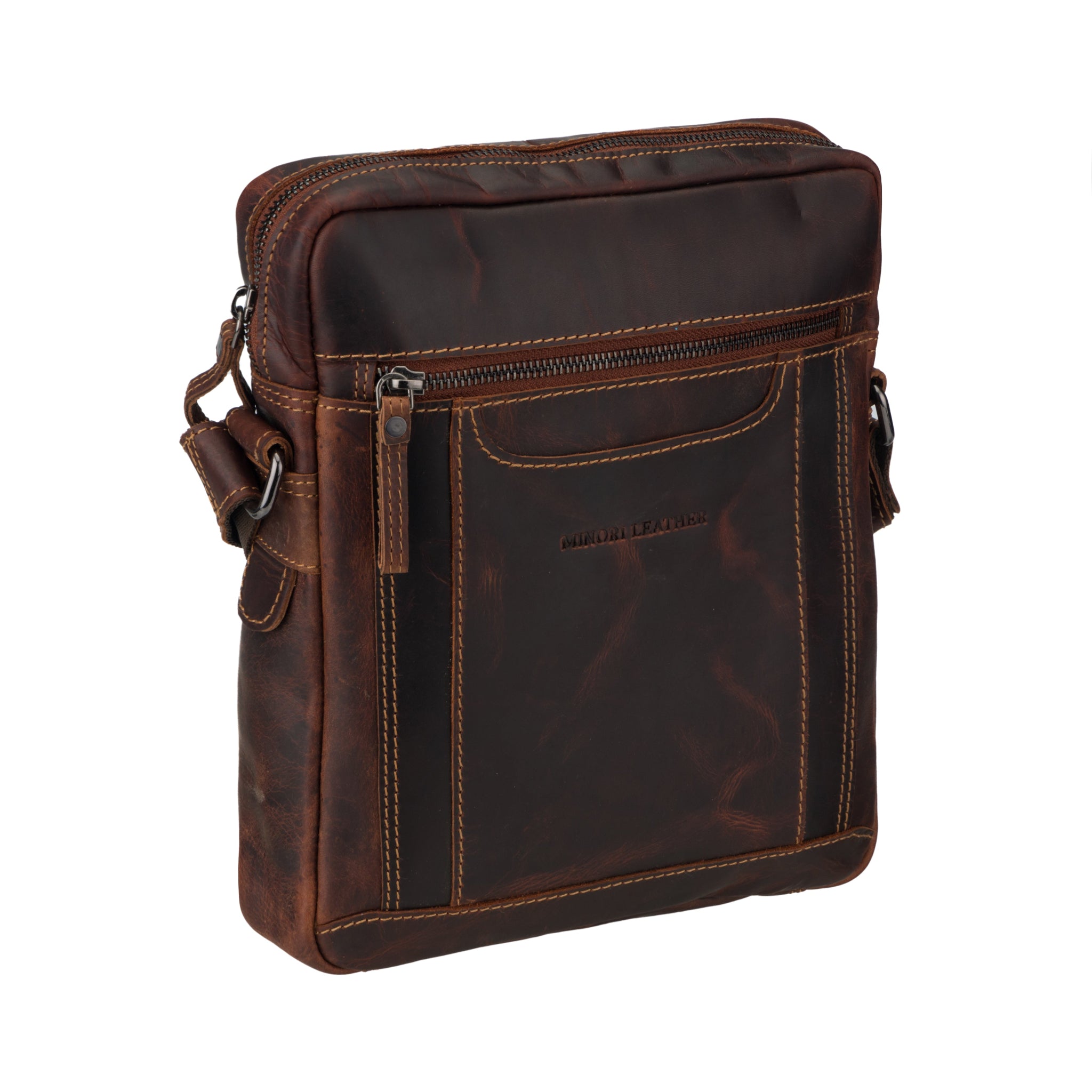 Angled view of Brown Minori leather crossbody bag on a white background