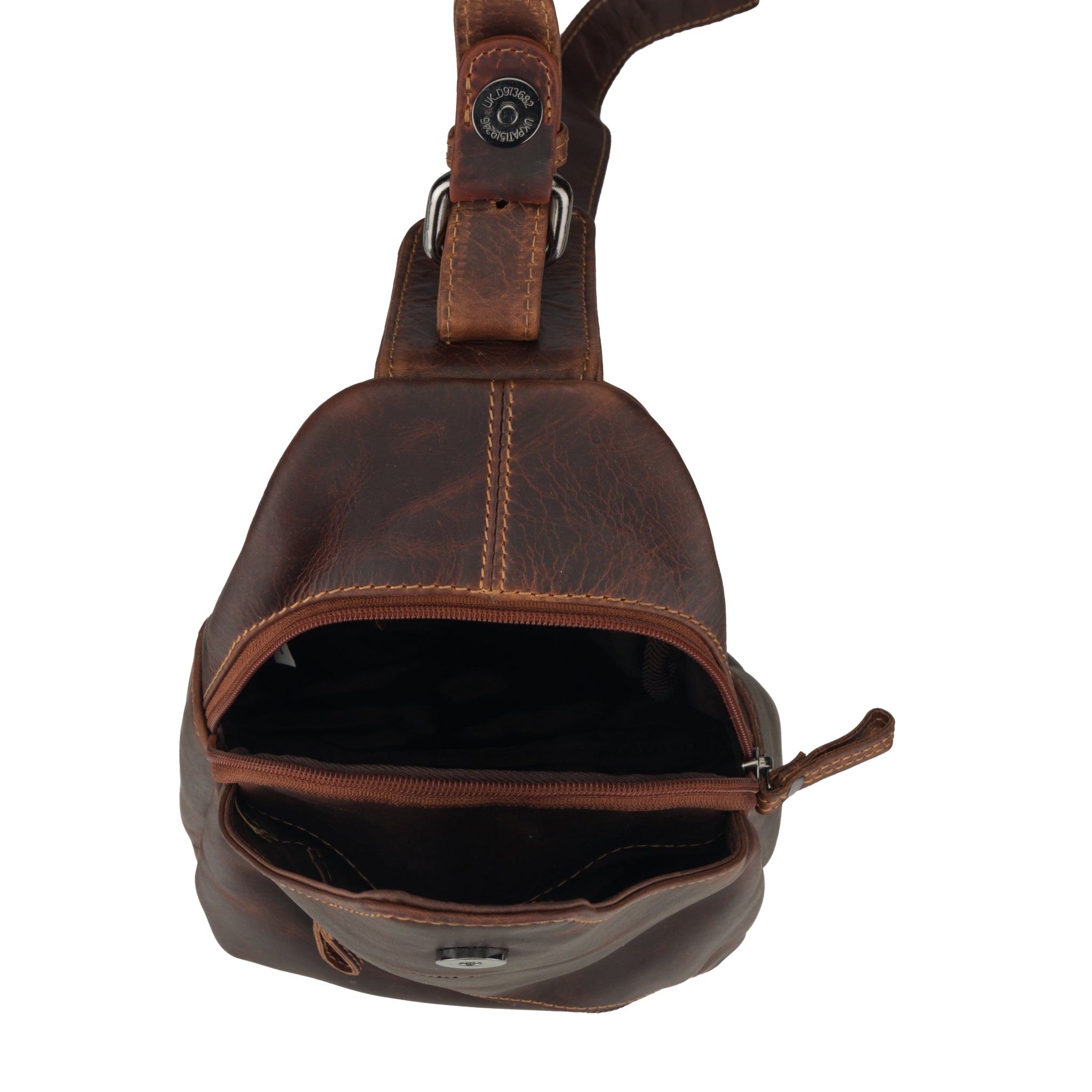 Top-open view of the chestnut brown Minori leather sling bag showing inner compartments.