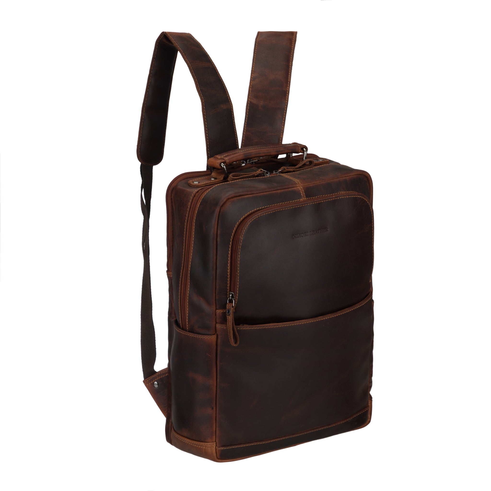 Side angle view of a chestnut brown Minori leather backpack highlighting the zippered front pocket and shoulder straps.