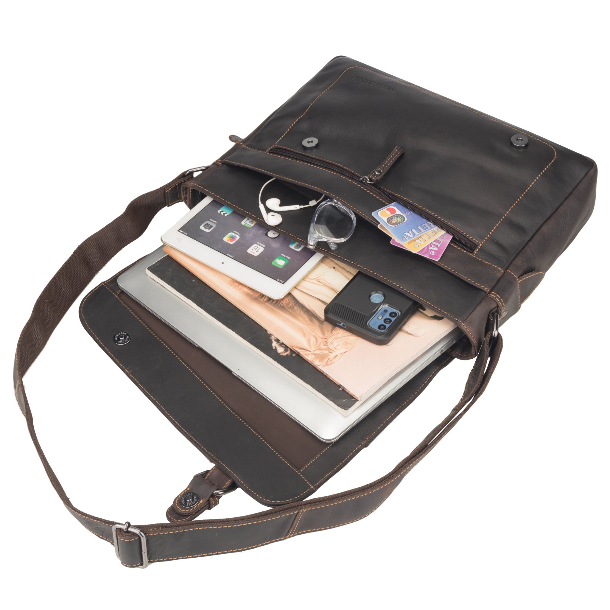 Brown Minori leather bag with compartments containing electronic devices and items on a white background