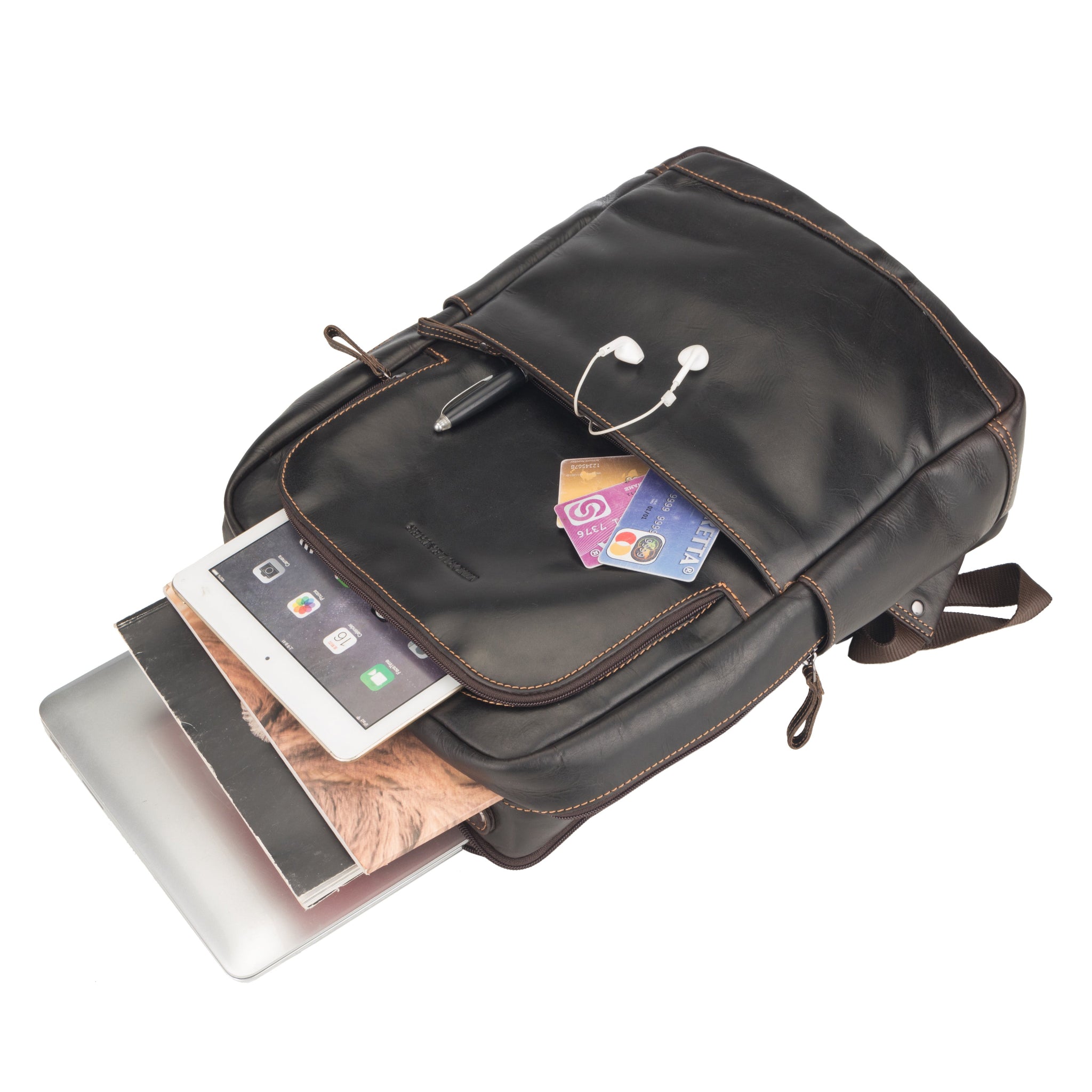 Brown Minori leather backpack with tech items like a laptop, tablet, and credit cards shown partially inside.
