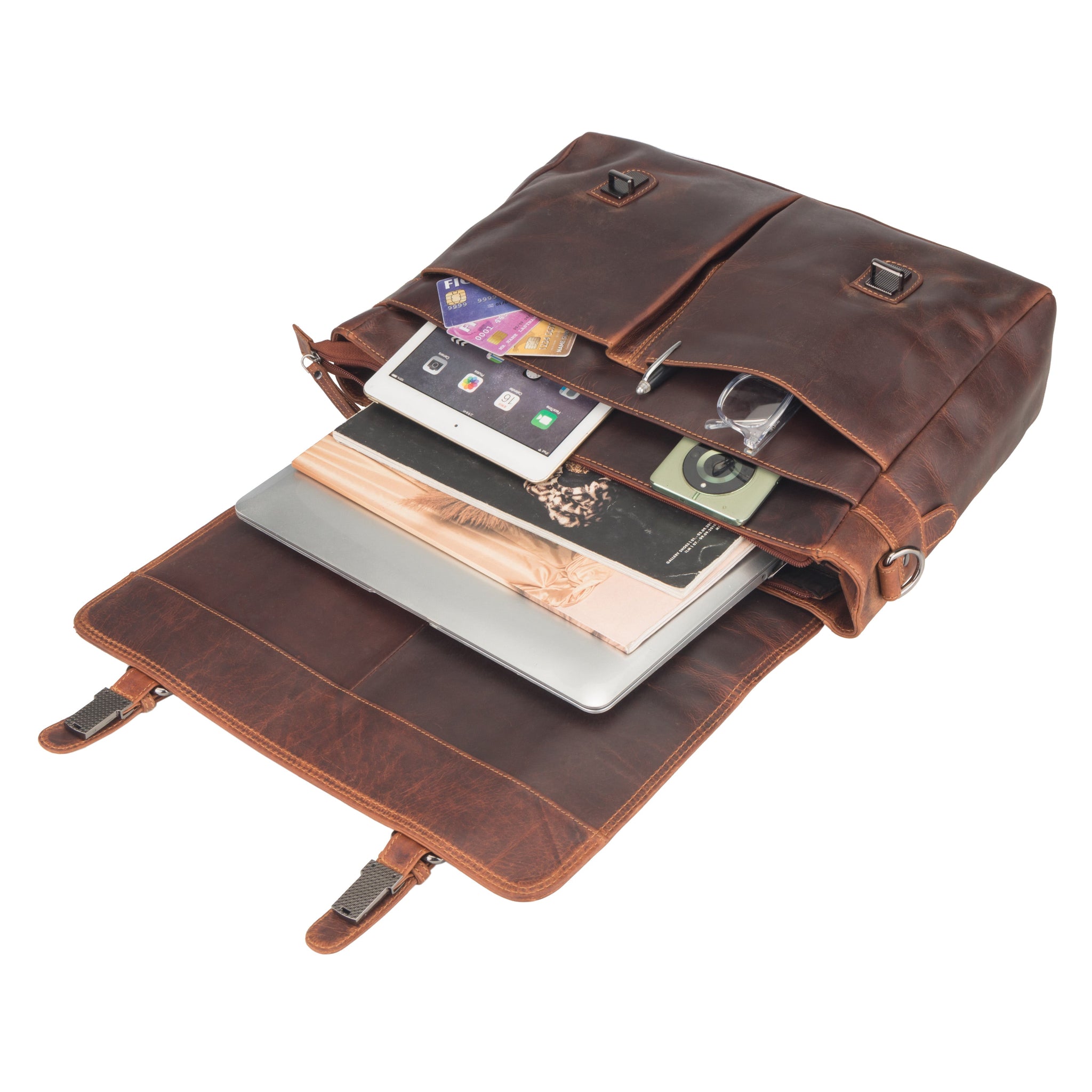 Brown Minori leather bag with compartments holding a laptop, phone, and other items on a white background