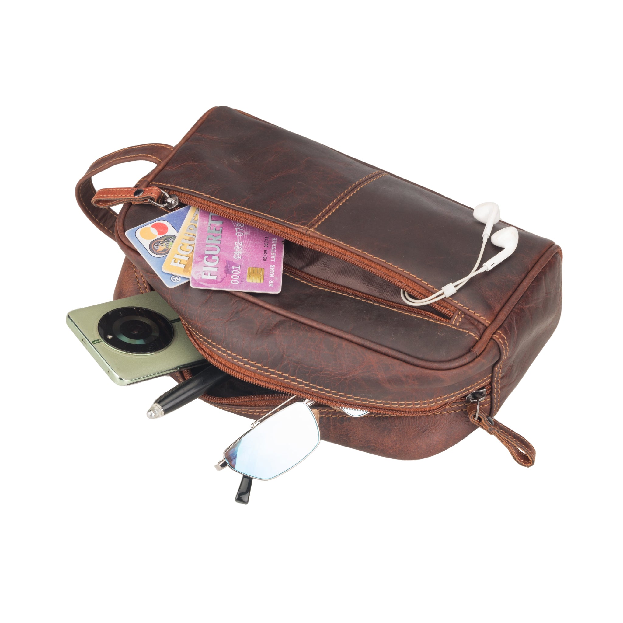 Brown Minori leather bag with various items including a smartphone, cards, and earphones on a white background