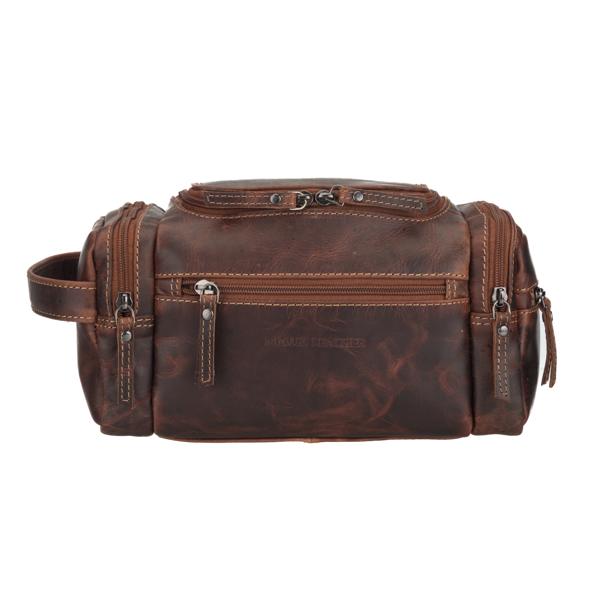 Front view of a Chestnut brown Minori leather toiletry bag with contrast stitching, front zipper pocket, and dual zipper top compartment.