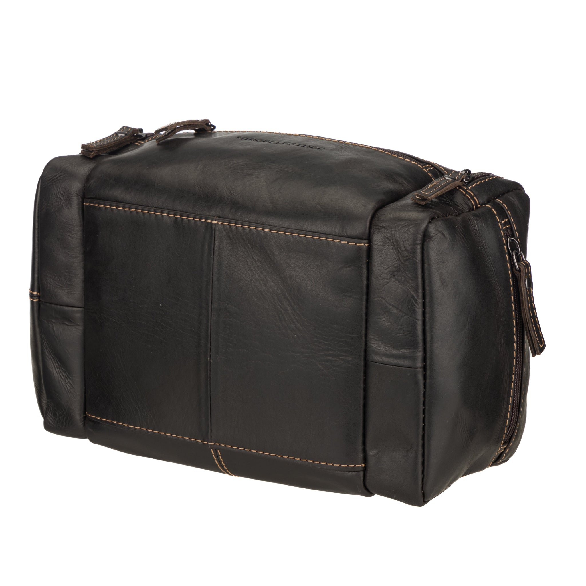 Angled rear view of brown Minori leather toiletry bag highlighting its boxy shape and durable leather texture.
