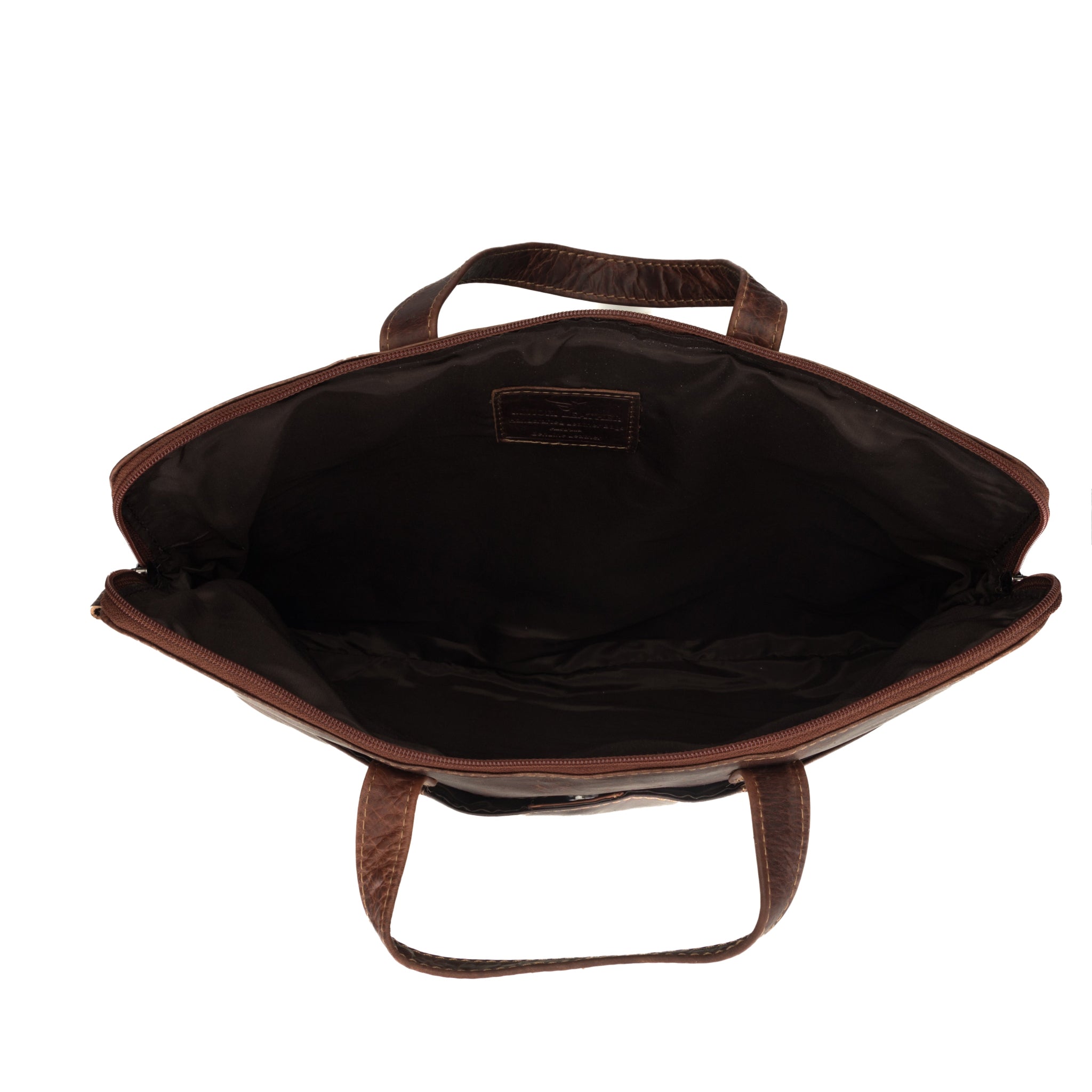 Top-down view of the interior of a brown Minori leather laptop bag, showing the spacious main compartment.