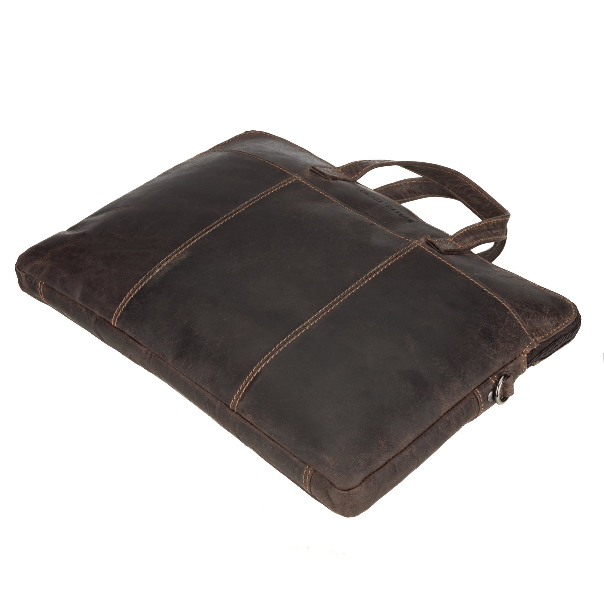 Side-angled shot of a slim Minori leather laptop bag lying flat, highlighting its compact and structured design.