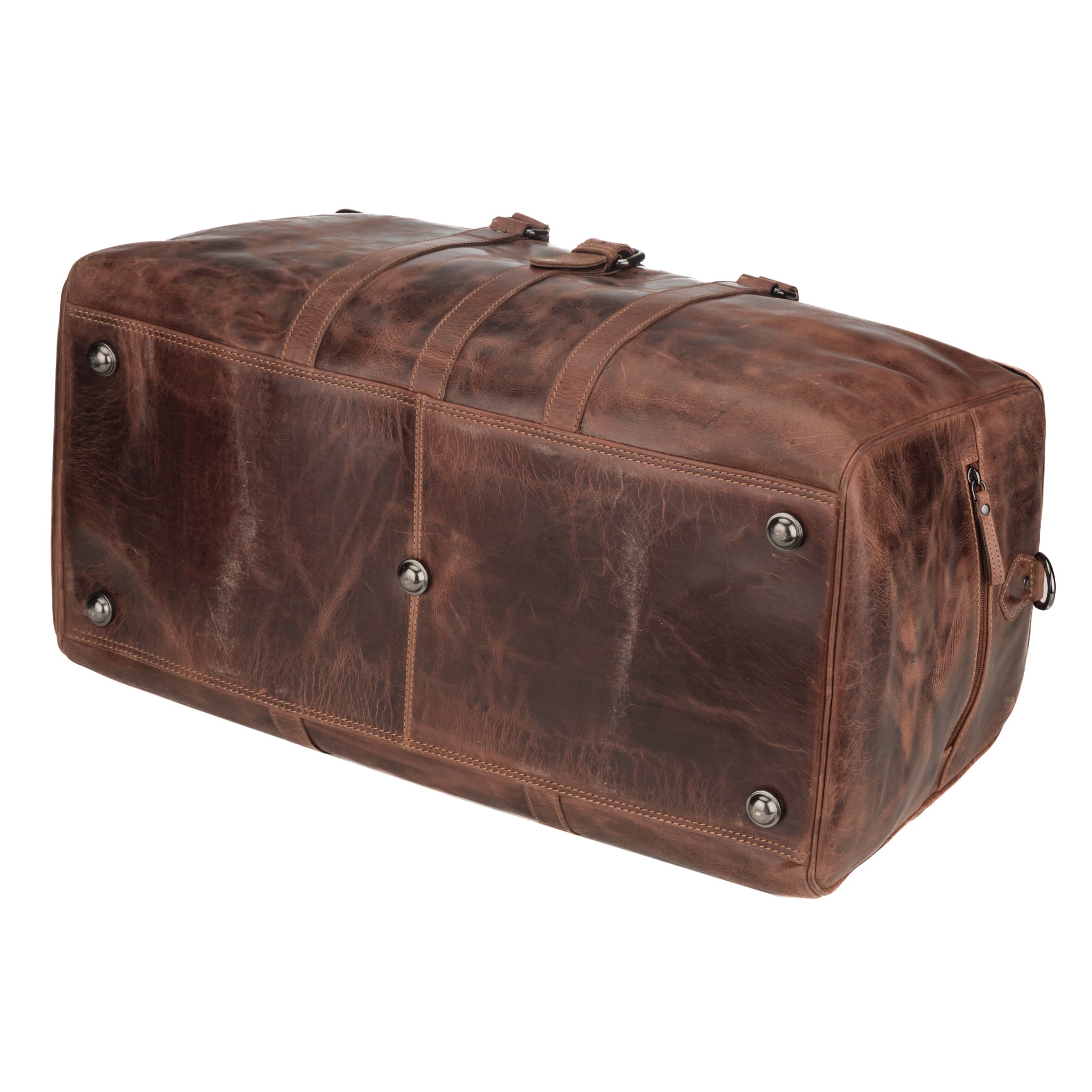 Bottom view of a chestnut brown Minori leather duffle bag with visible metal studs for added base protection and leather texture detail.