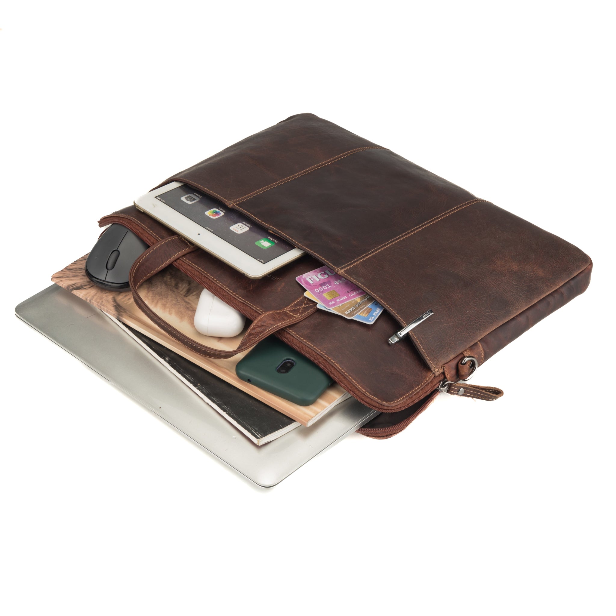 Brown Minori leather laptop bag filled with electronic accessories including a tablet, mouse, cards, and AirPods, demonstrating its capacity and functionality.