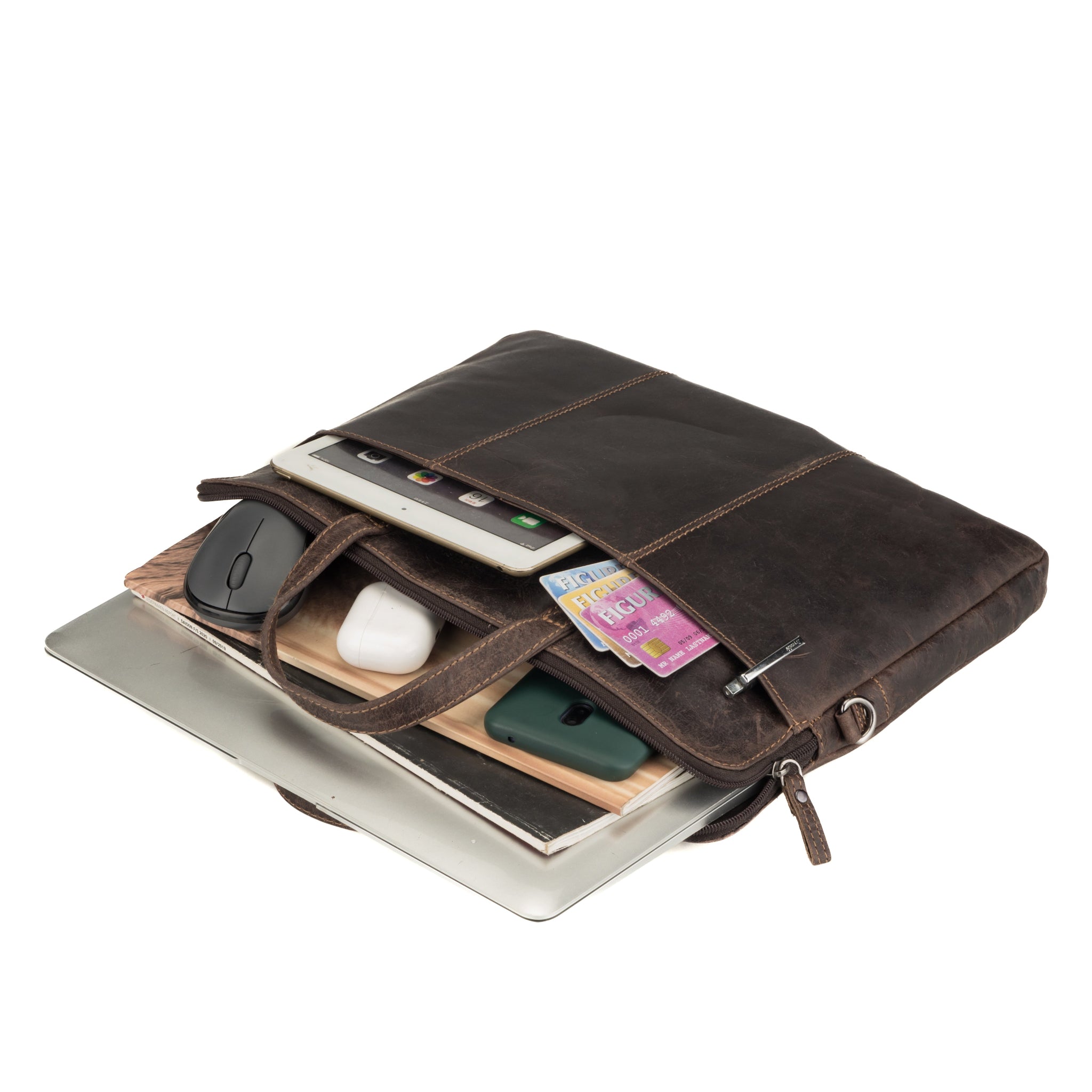 Brown Minori leather laptop bag filled with electronic accessories including a tablet, mouse, cards, and AirPods, demonstrating its capacity and functionality.
