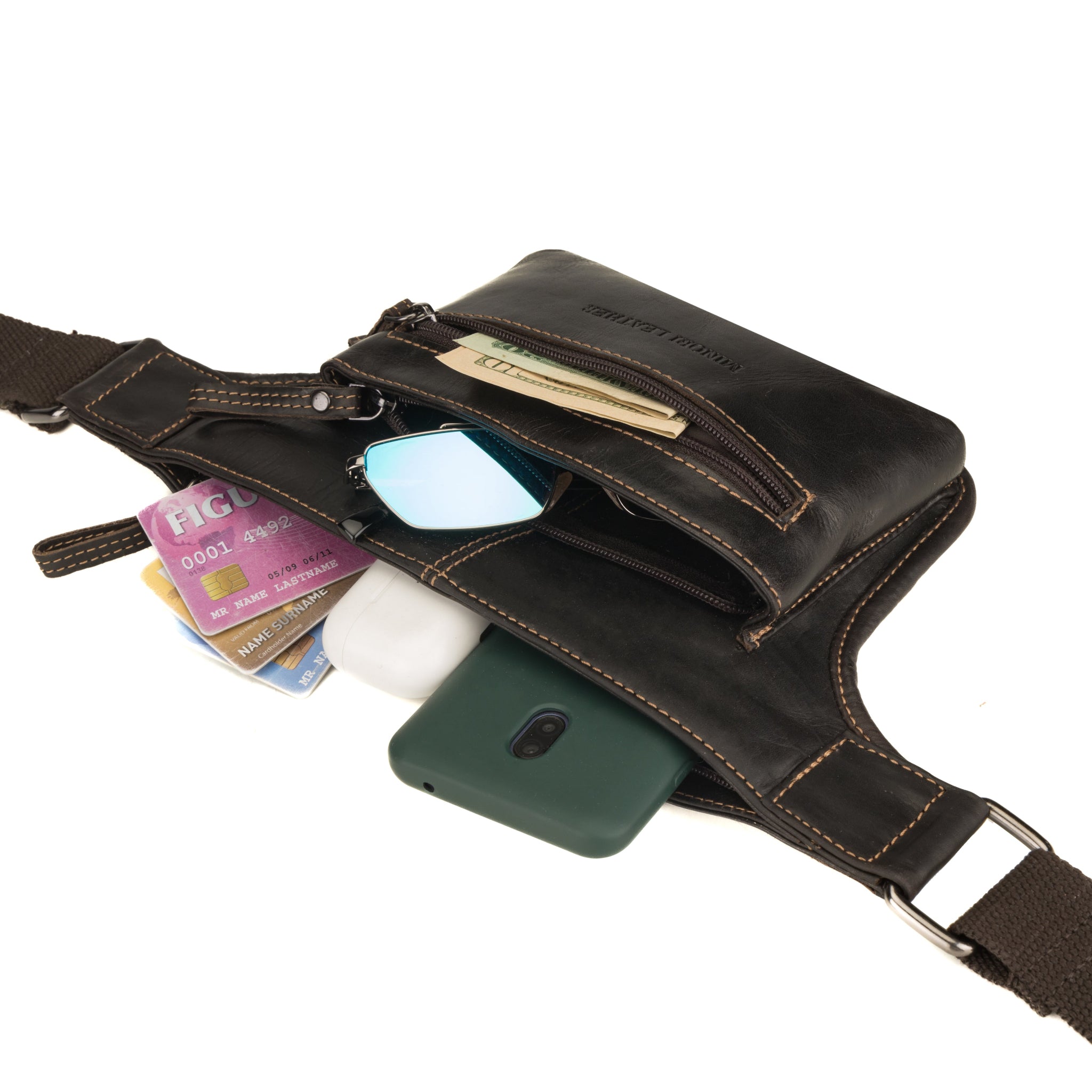 Brown waist bag by Minori Leather displayed with open compartments revealing cards, currency, and personal items.