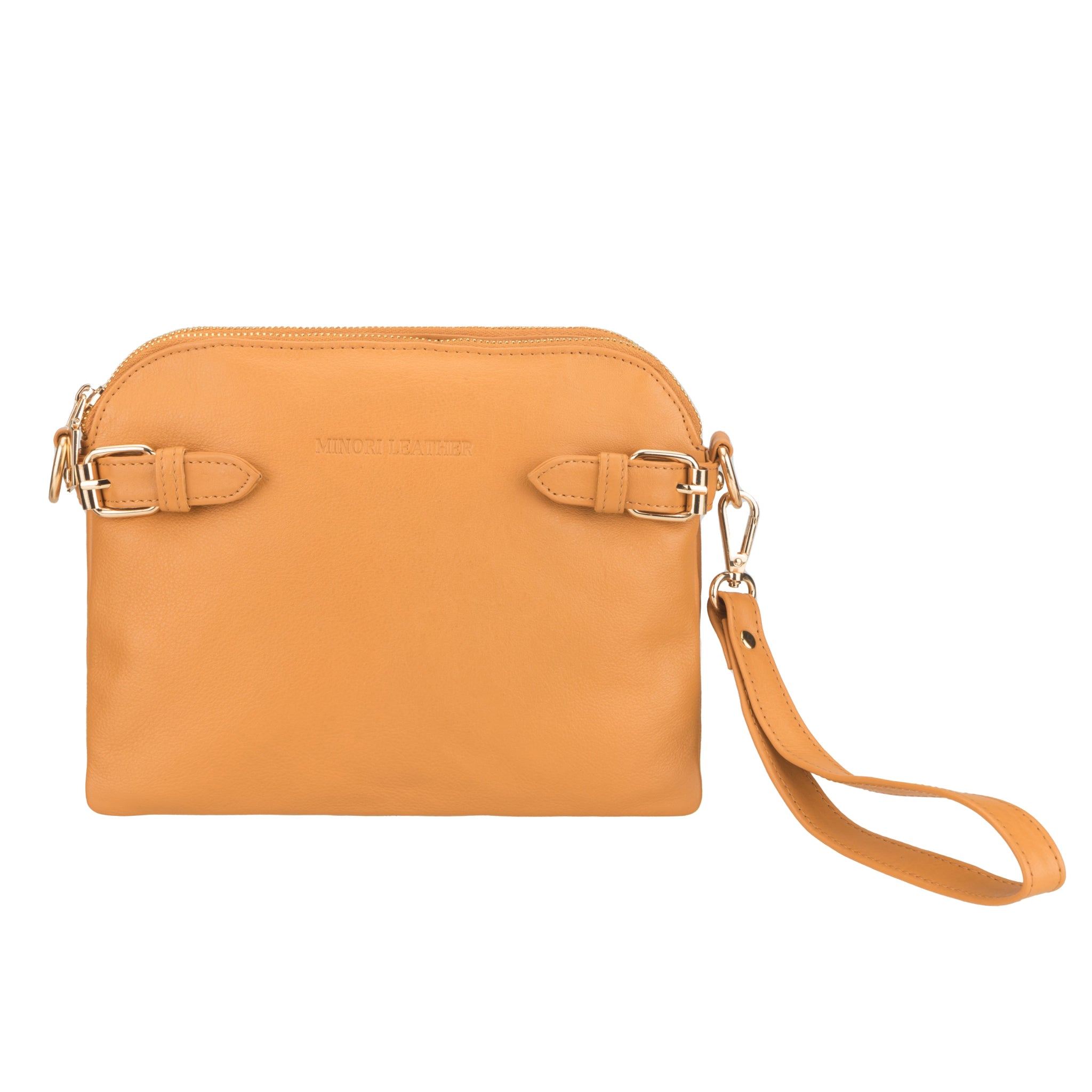 Front view of tan Minori leather handbag with buckle detailing and detachable wrist strap.