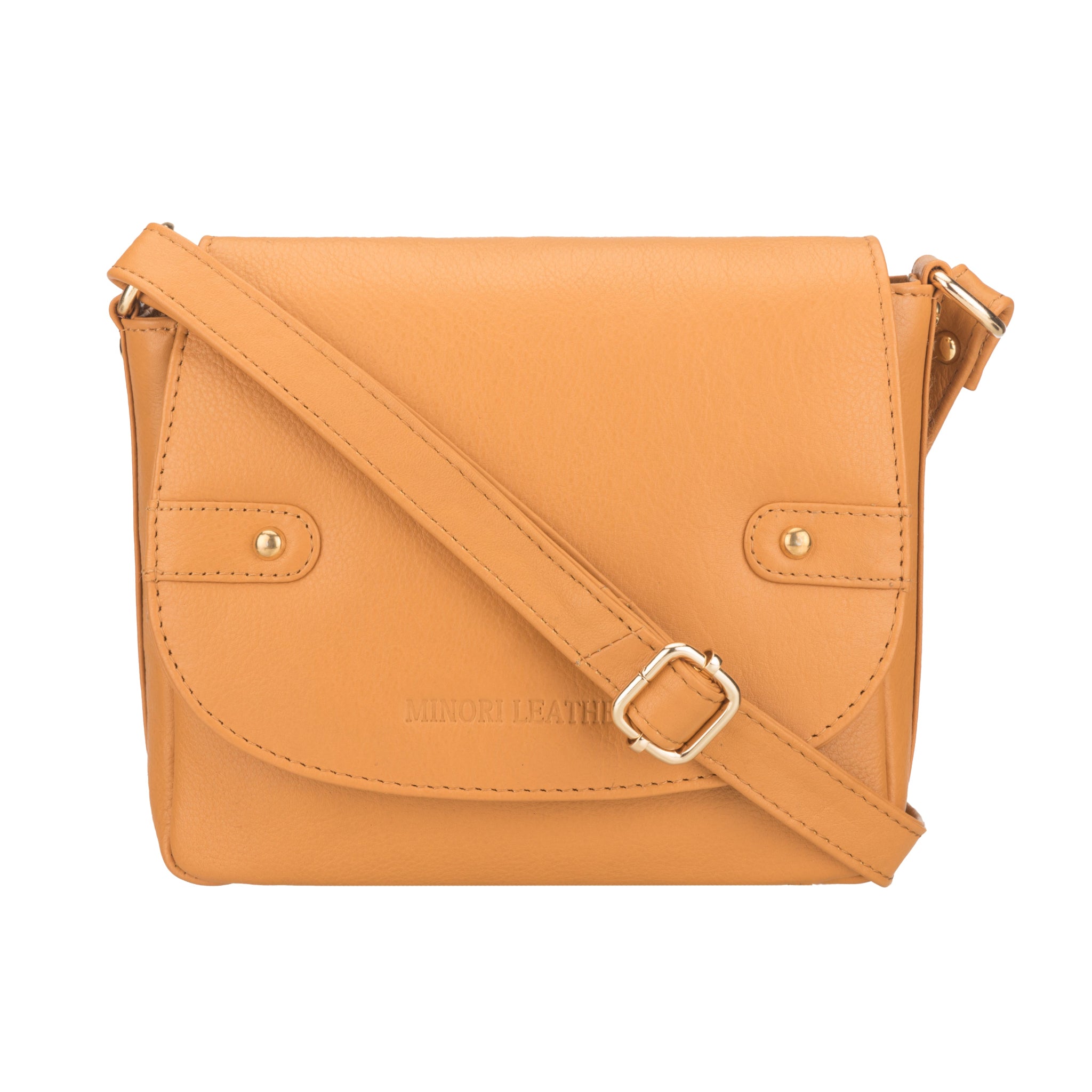 Tan Minori leather crossbody bag with a strap on a white background