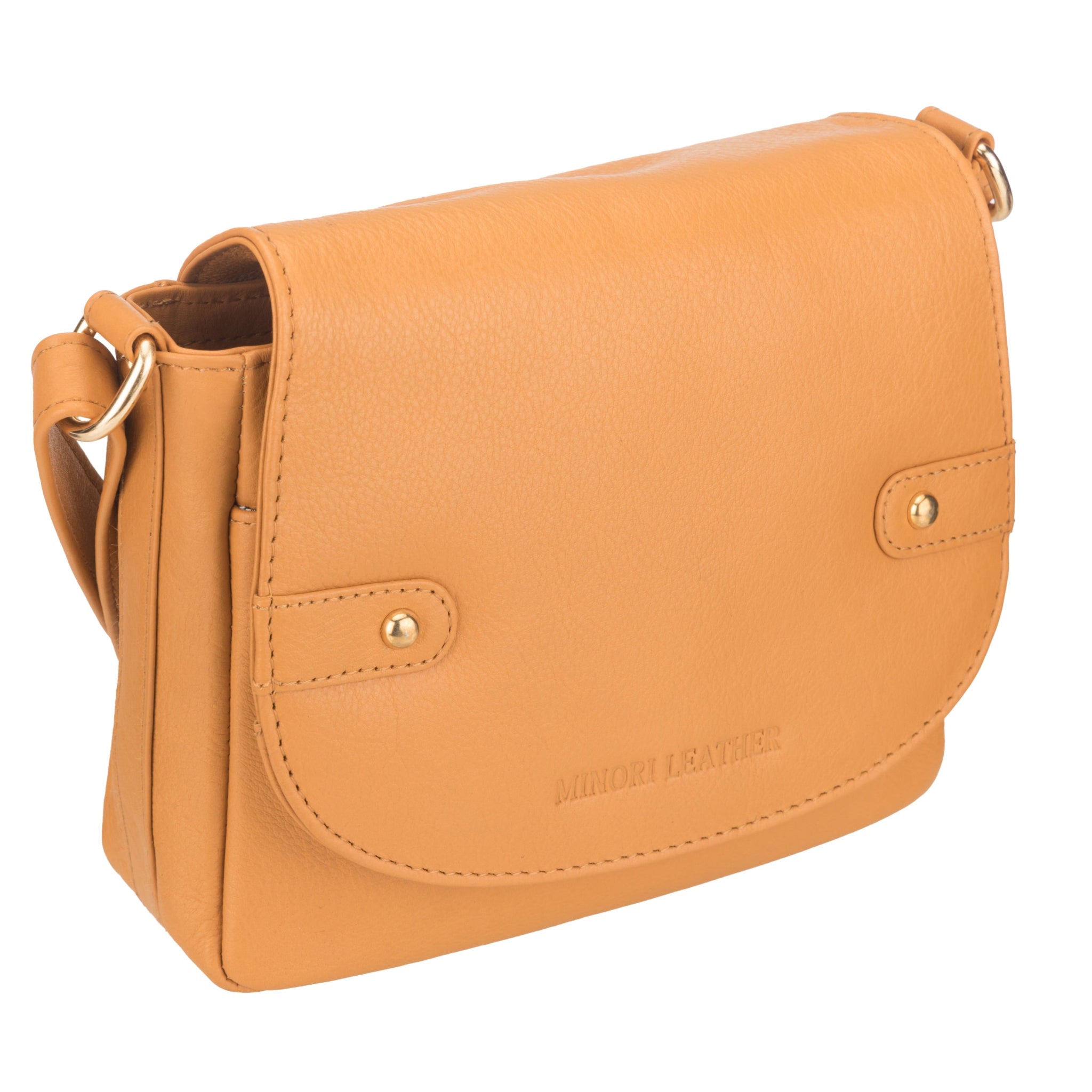 Angled view of Tan Minori leather handbag with gold accents on a white background
