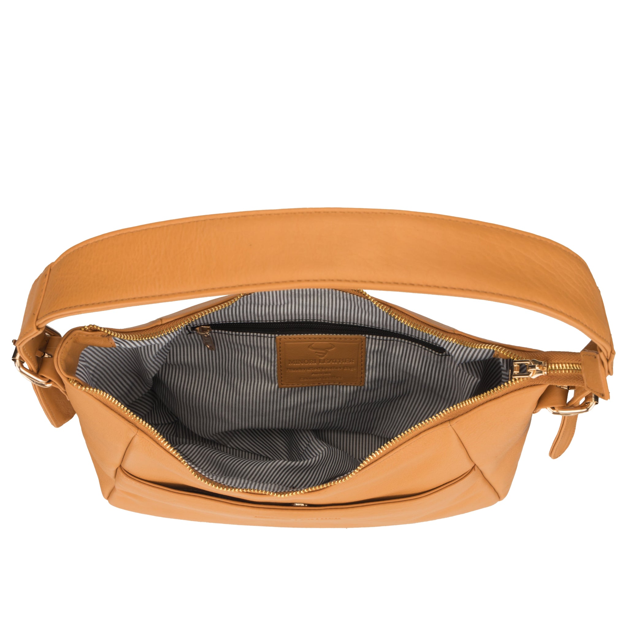 Interior view of a tan nappa Minori leather bag featuring a striped fabric lining and zip pocket.