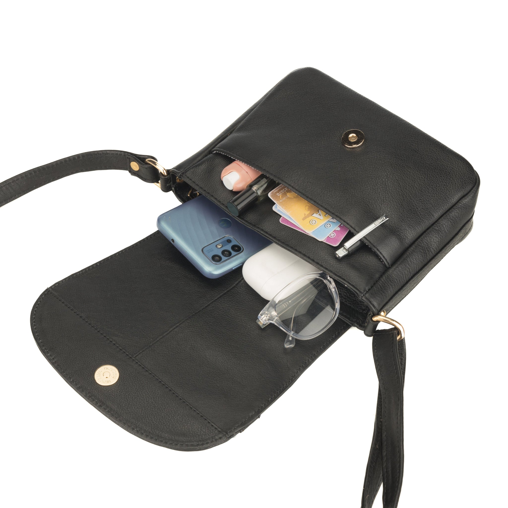 Black Minori leather crossbody bag with compartments for phone, cards, and a bottle on a white background