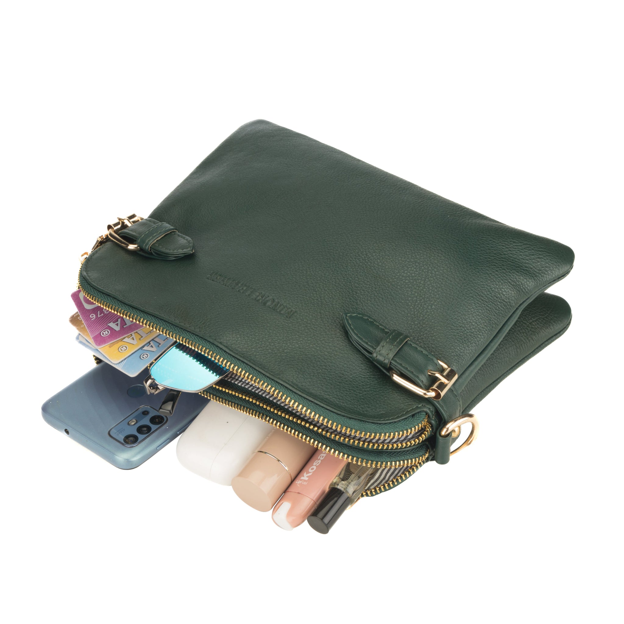 Forest Green Minori leather clutch with gold zipper, phone, cards, and lipsticks on a white background