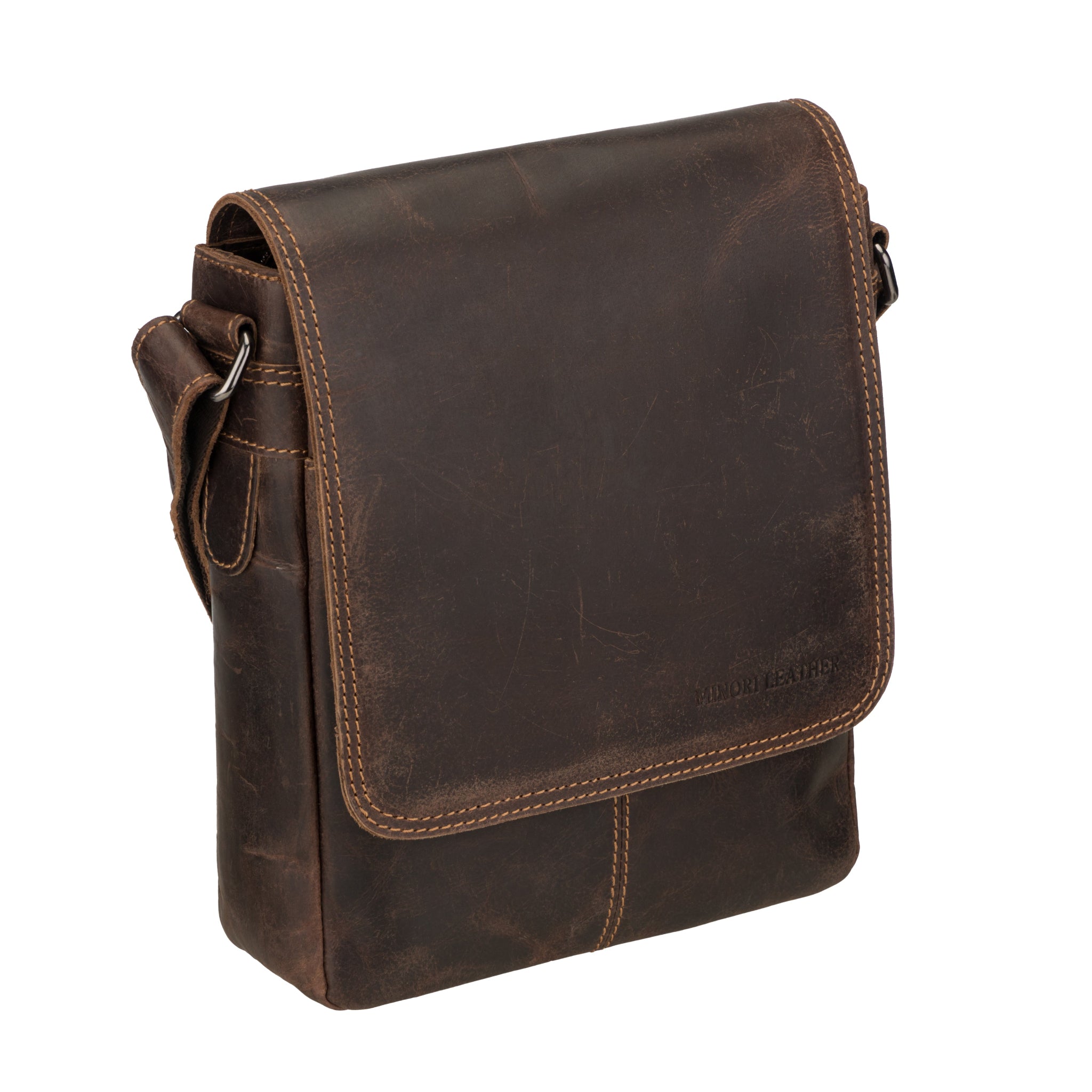 Angled view of Brown Minori leather messenger bag on a white background