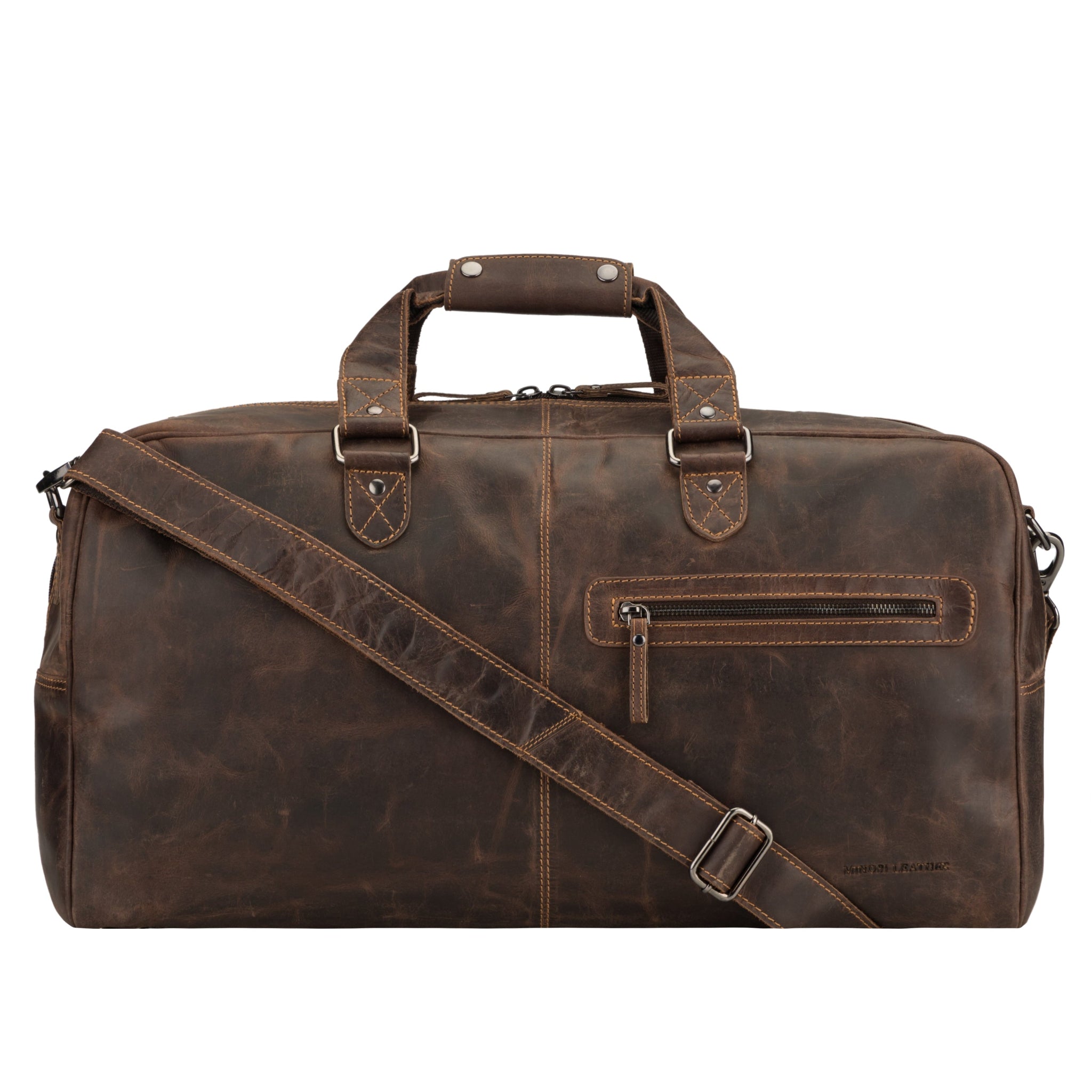 Straight-on view of a brown Minori leather duffle bag with crossbody strap attached and front pocket visible.