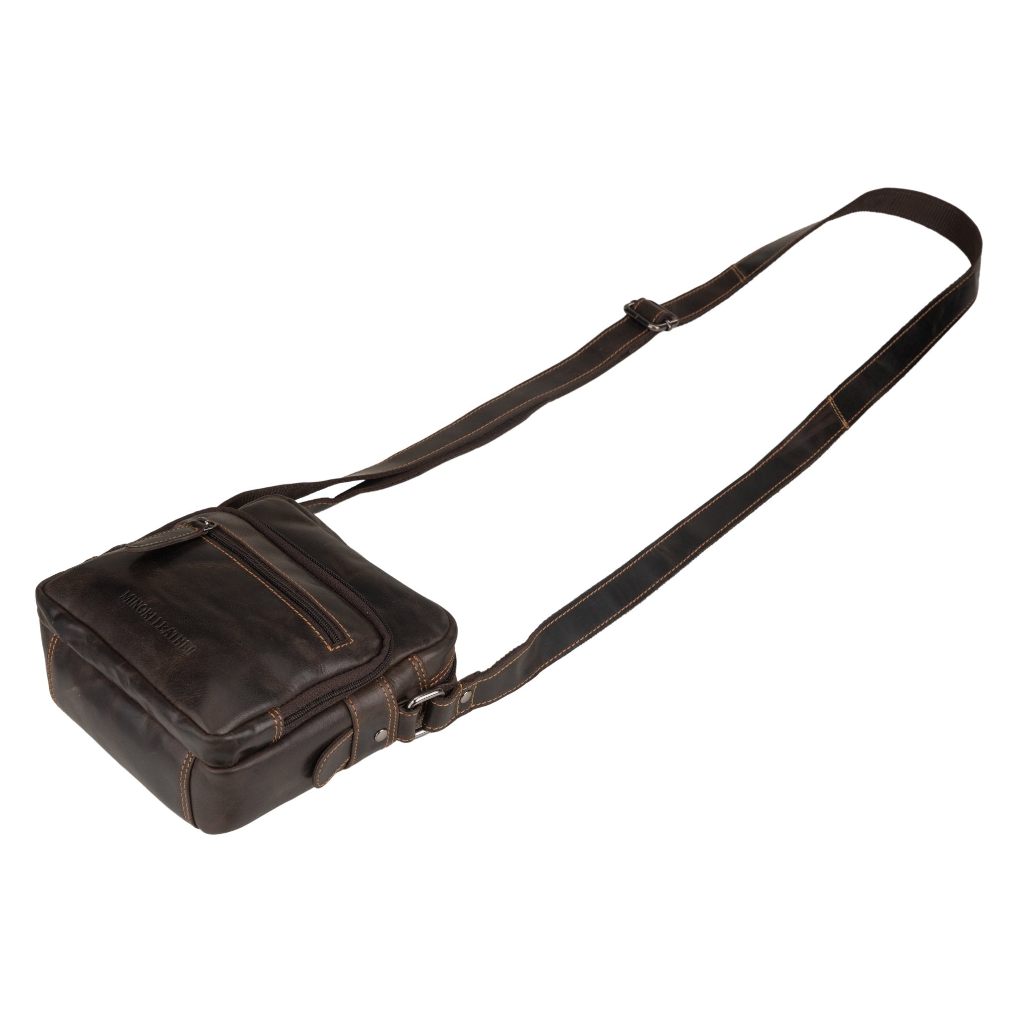 Minori Leather brown Cove leather crossbody bag with adjustable strap and minimalist design, showing its sleek exterior and stitching.