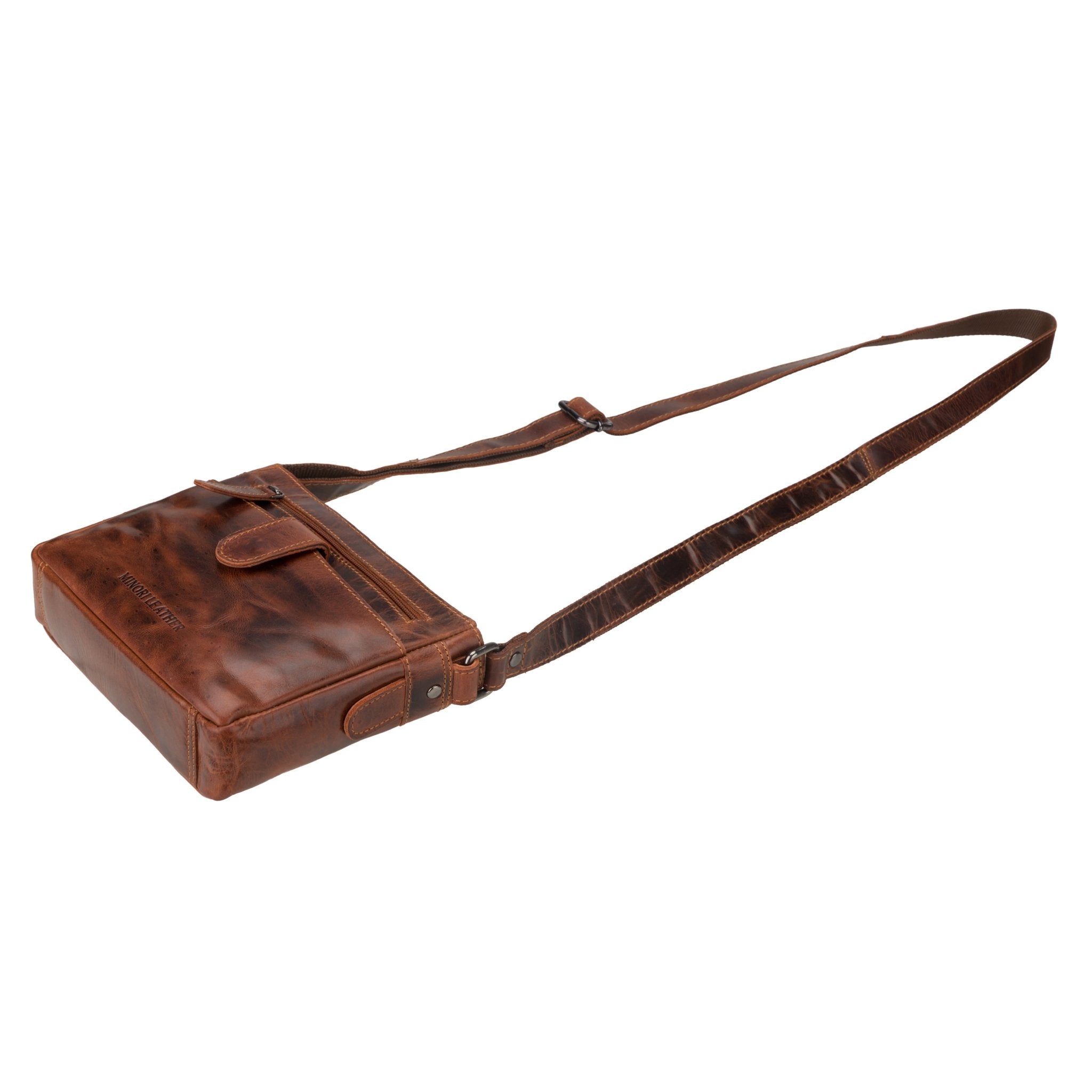 Minori Leather unisex chestnut leather crossbody bag with adjustable strap and sleek design.