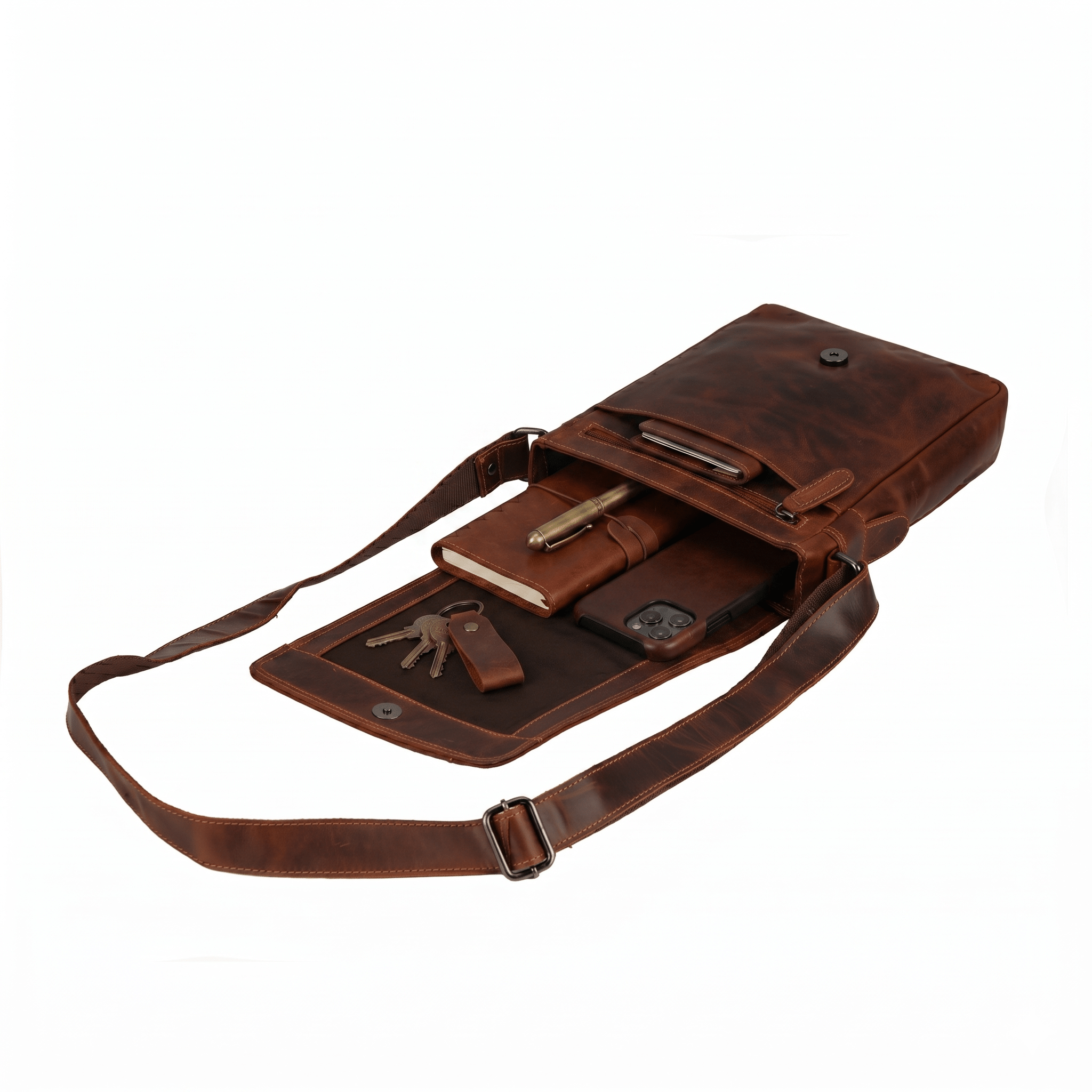 Minori Leather Knox leather crossbody bag with adjustable strap and sleek design, shown in a tan color.
