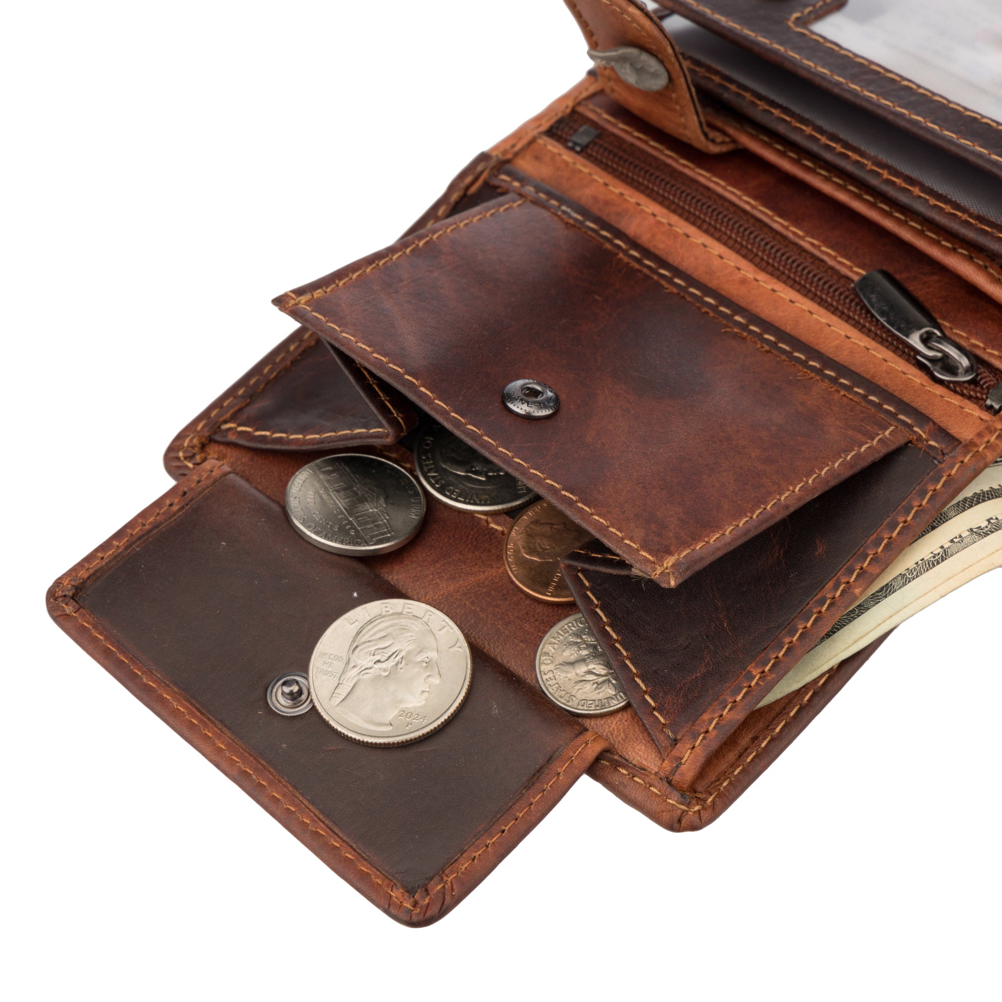 Close-up of an open chestnut Minori leather wallet displaying a snap-button coin pocket filled with assorted coins, with cash bills partially visible in a compartment underneath.