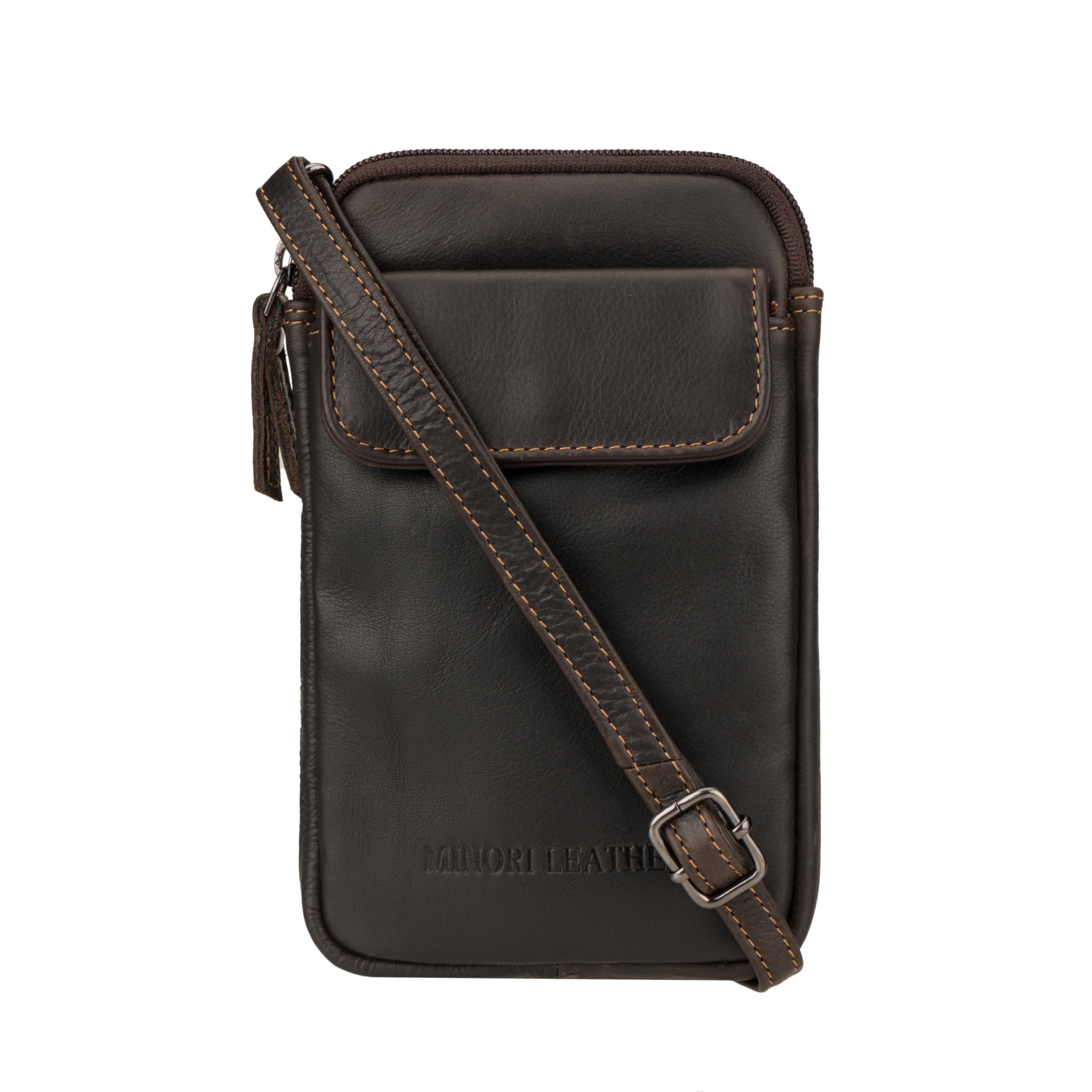 Close-up of a dark brown Minori leather mobile sling bag with an adjustable strap placed across the bag's front.