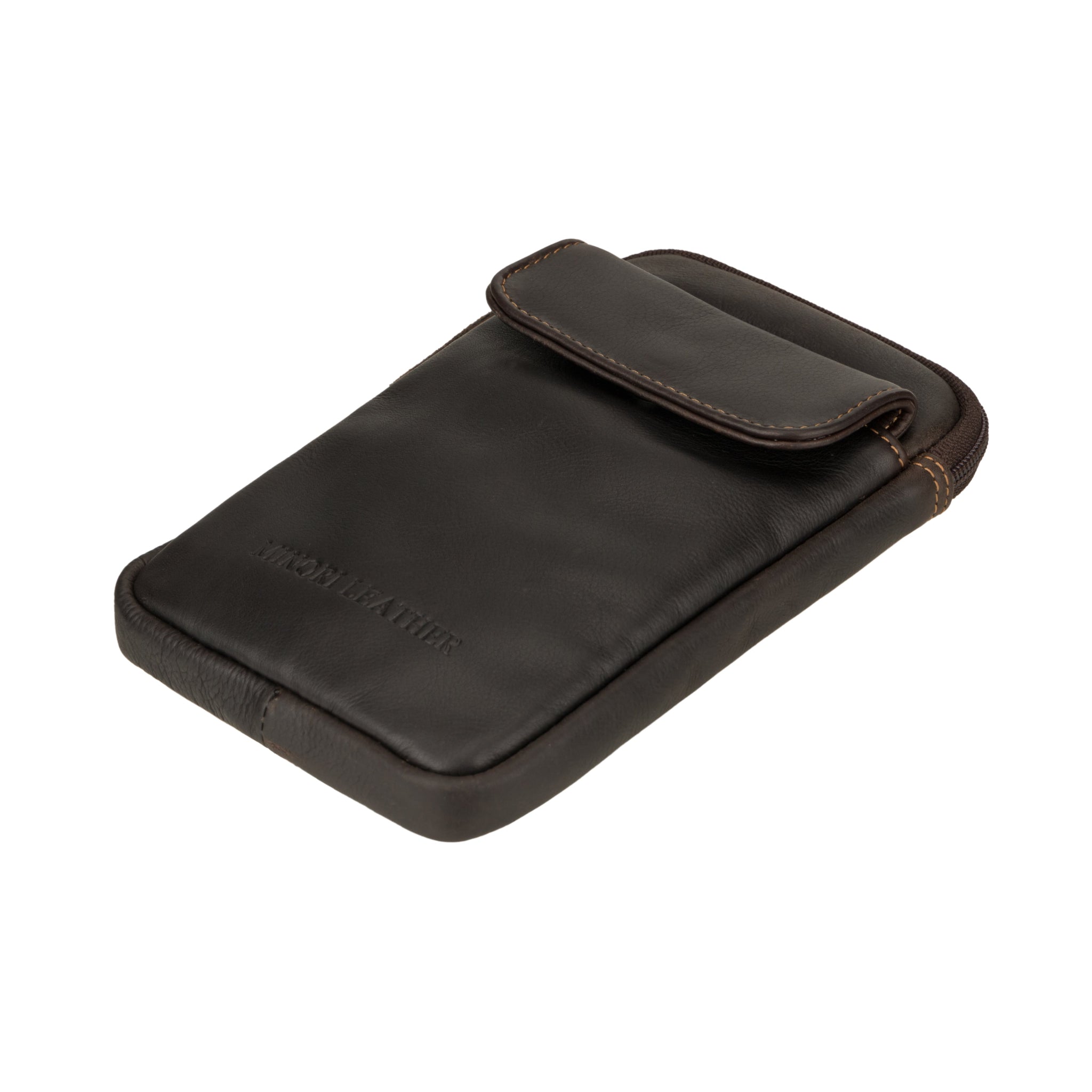 Side-angled view of a dark brown Minori leather sling bag lying flat to showcase the slim profile and flap.