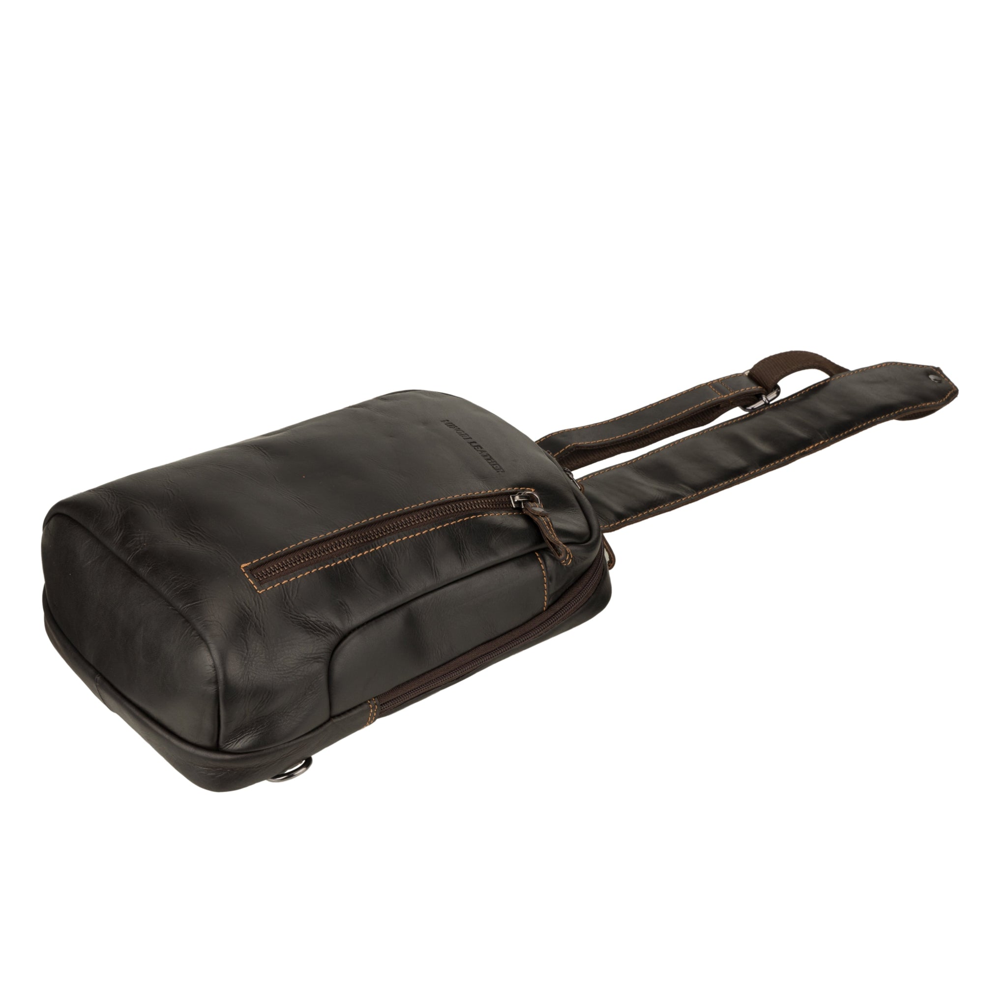 Bottom side view of a brown Minori leather crossbody sling bag laid flat, showing the structure and zip closure.