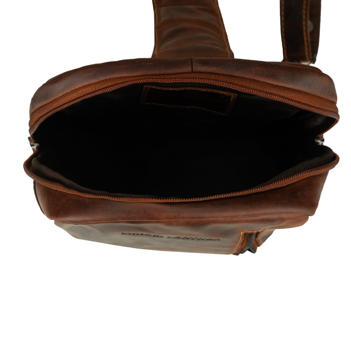 Minori Leather luxe chestnut leather sling bag, crossbody style with adjustable strap and sleek design for everyday use.