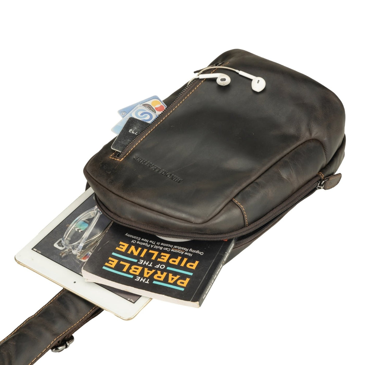 Minori Leather Luxe Brown Leather Crossbody Sling Bag with adjustable strap and sleek design.