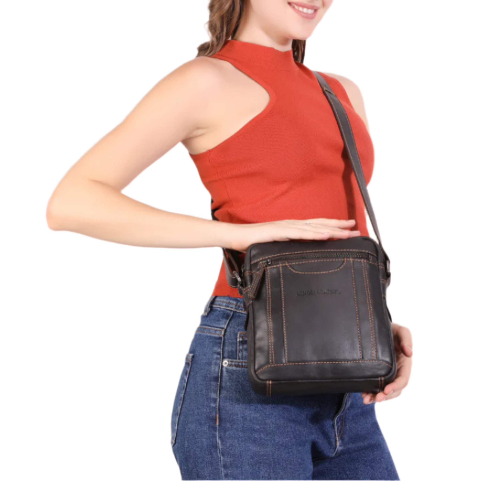 Woman holding a Brown Minori leather crossbody bag against a white background