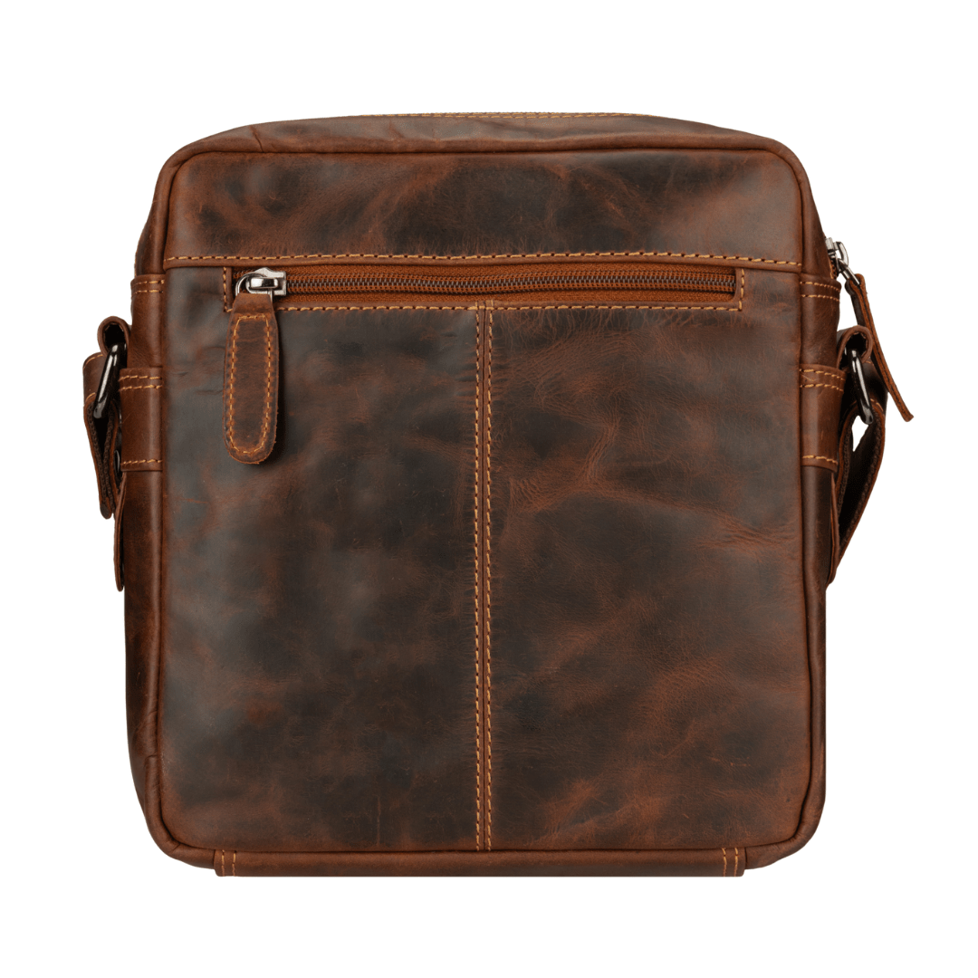 Minori Leather Harbor Crossbody Bag in chestnut leather with adjustable strap and sleek design.