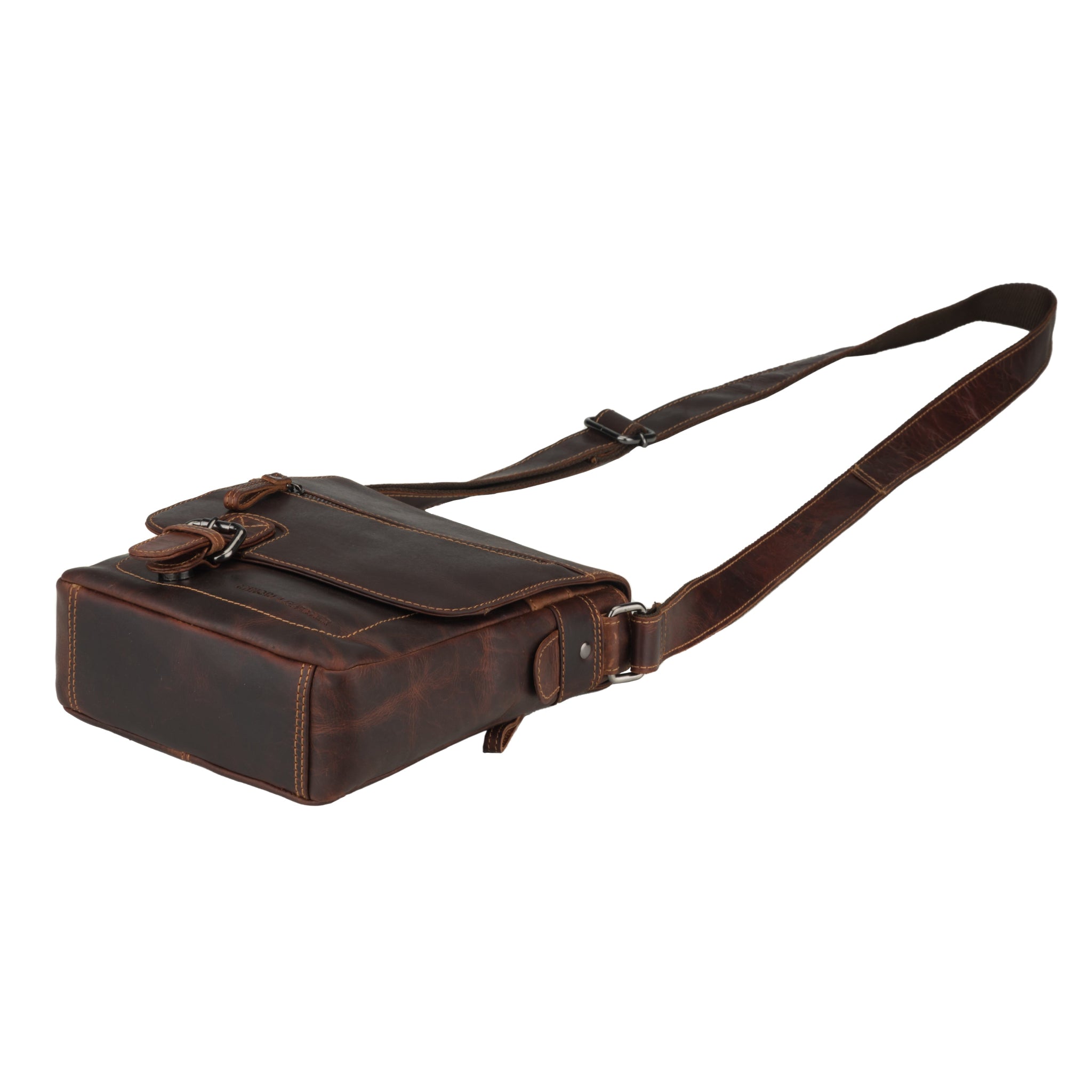 Bottom-side view of a chestnut brown Minori leather crossbody bag showing its thickness and shape.