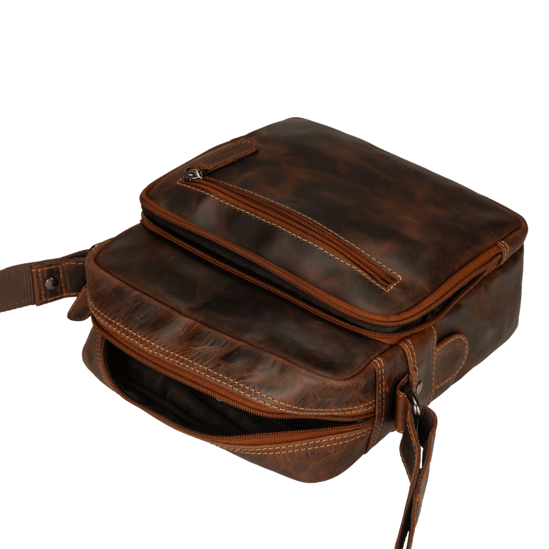 Minori Leather Harbor crossbody bag in chestnut leather with adjustable strap and minimalist design.