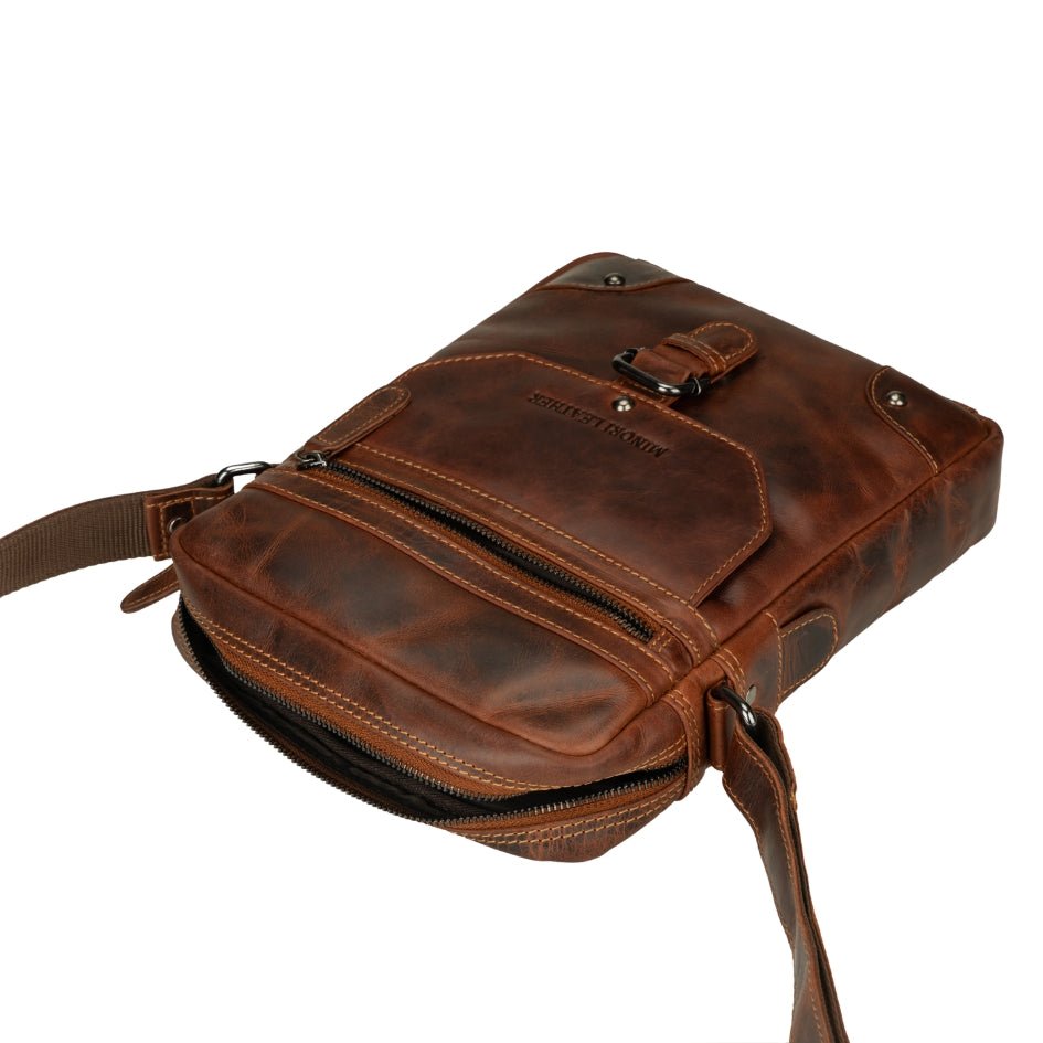 Minori Leather Denver leather crossbody bag in chestnut, unisex design with adjustable strap and sleek textured finish.