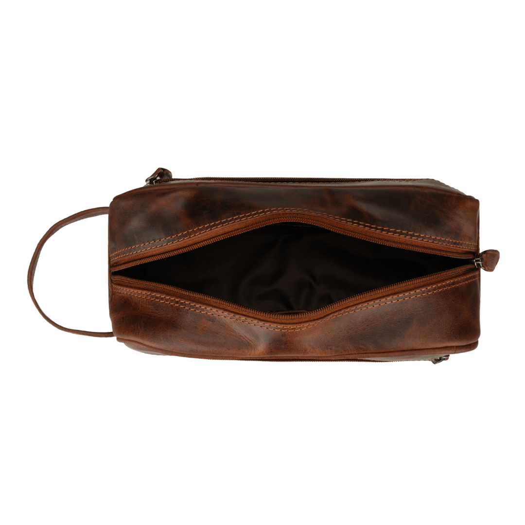 Minori Leather Montana chestnut leather toiletry bag for men with zipper closure and compact design for travel essentials.