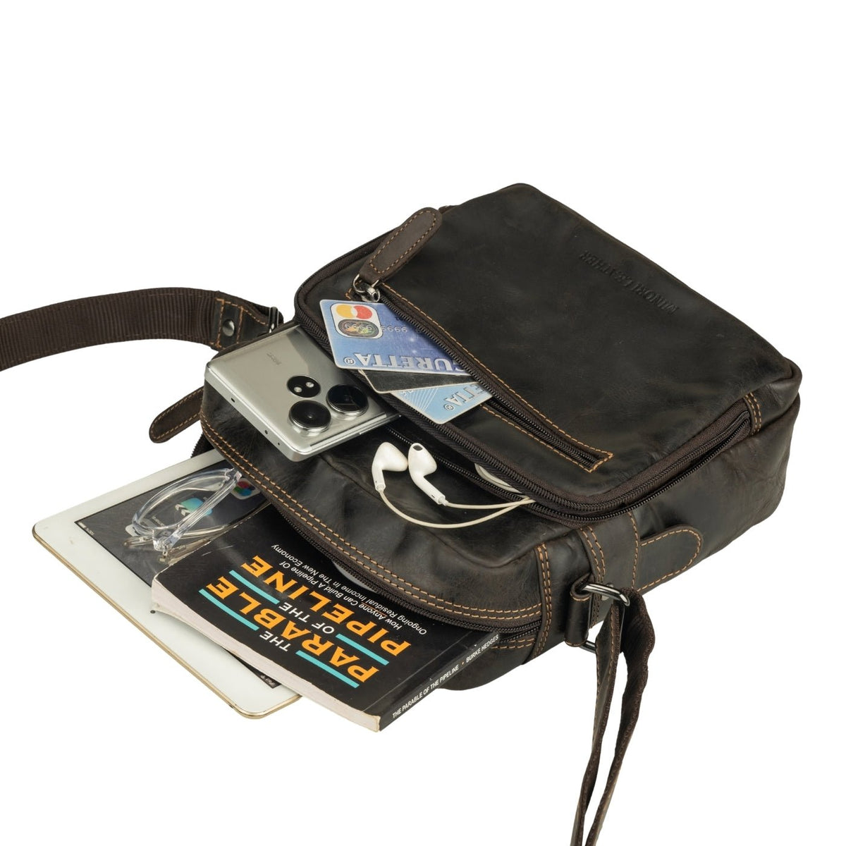 Minori Leather Harbor brown leather crossbody messenger bag with adjustable strap and minimalist design.