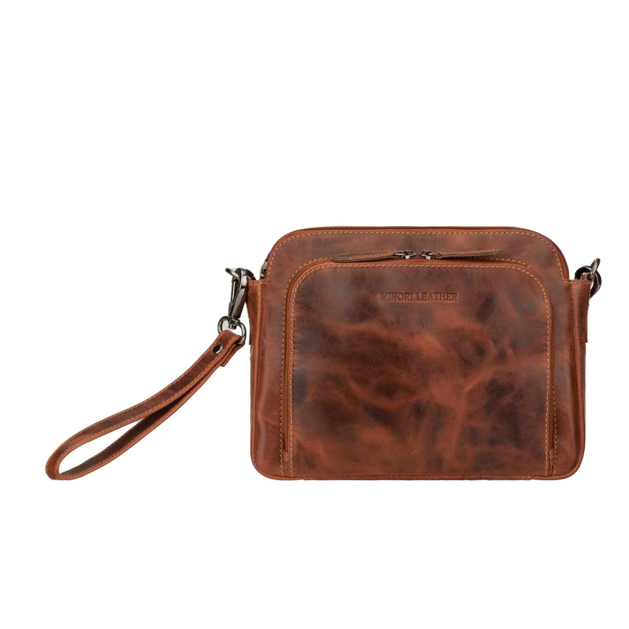 Minori Leather Ellis Crossbody Bag in chestnut leather, featuring a sleek design with adjustable strap and silver hardware.