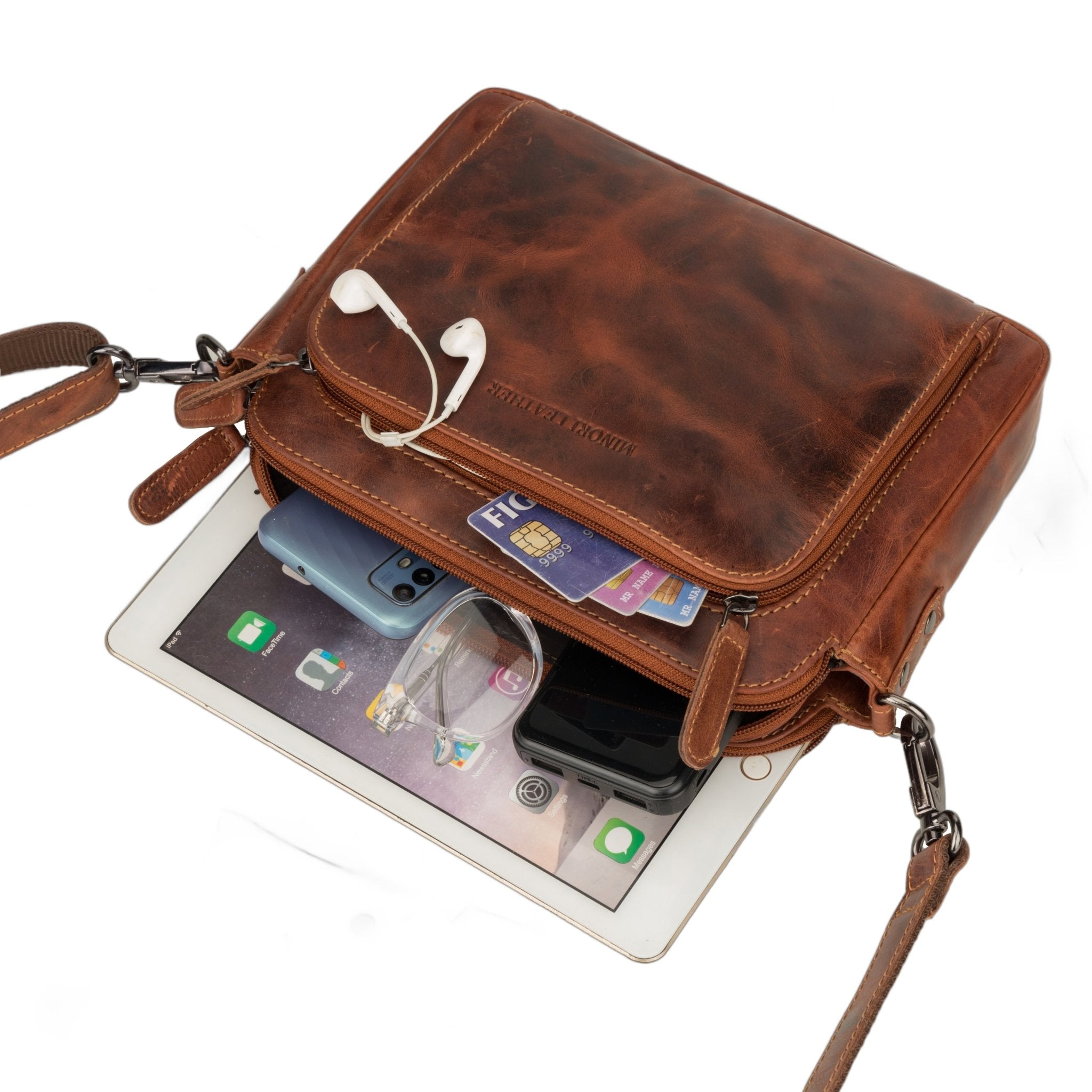 Minori Leather Ellis leather crossbody bag in chestnut with adjustable strap and minimalist design.