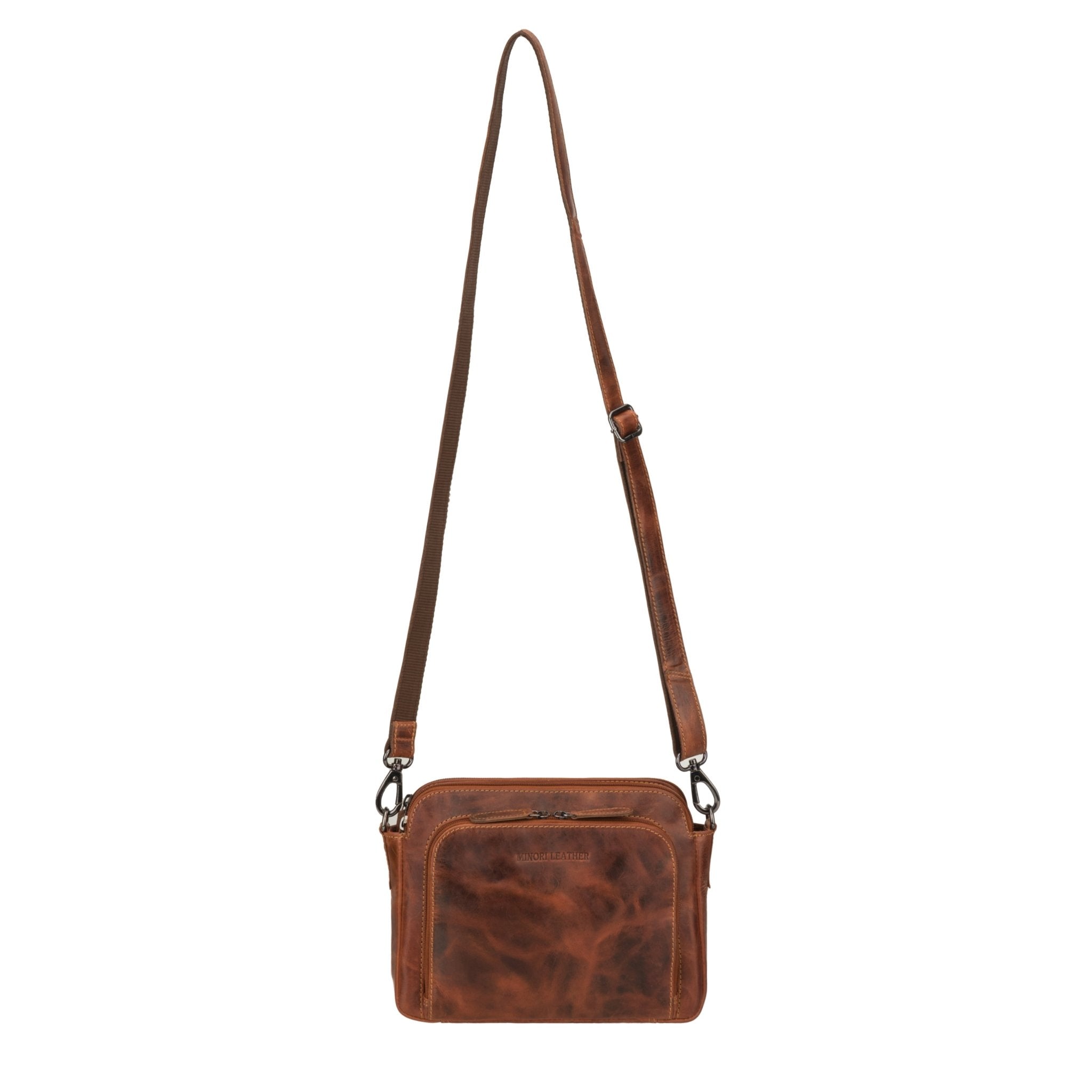 Minori Leather Ellis leather crossbody bag in chestnut, featuring a sleek design with adjustable strap and minimalistic style.
