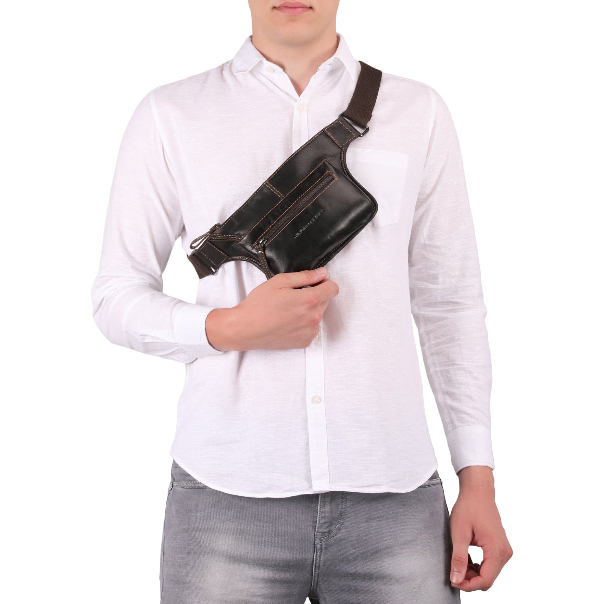 Male model carrying a brown Minori leather fanny pack on his shoulders featuring multiple compartments and an adjustable strap with buckle closure