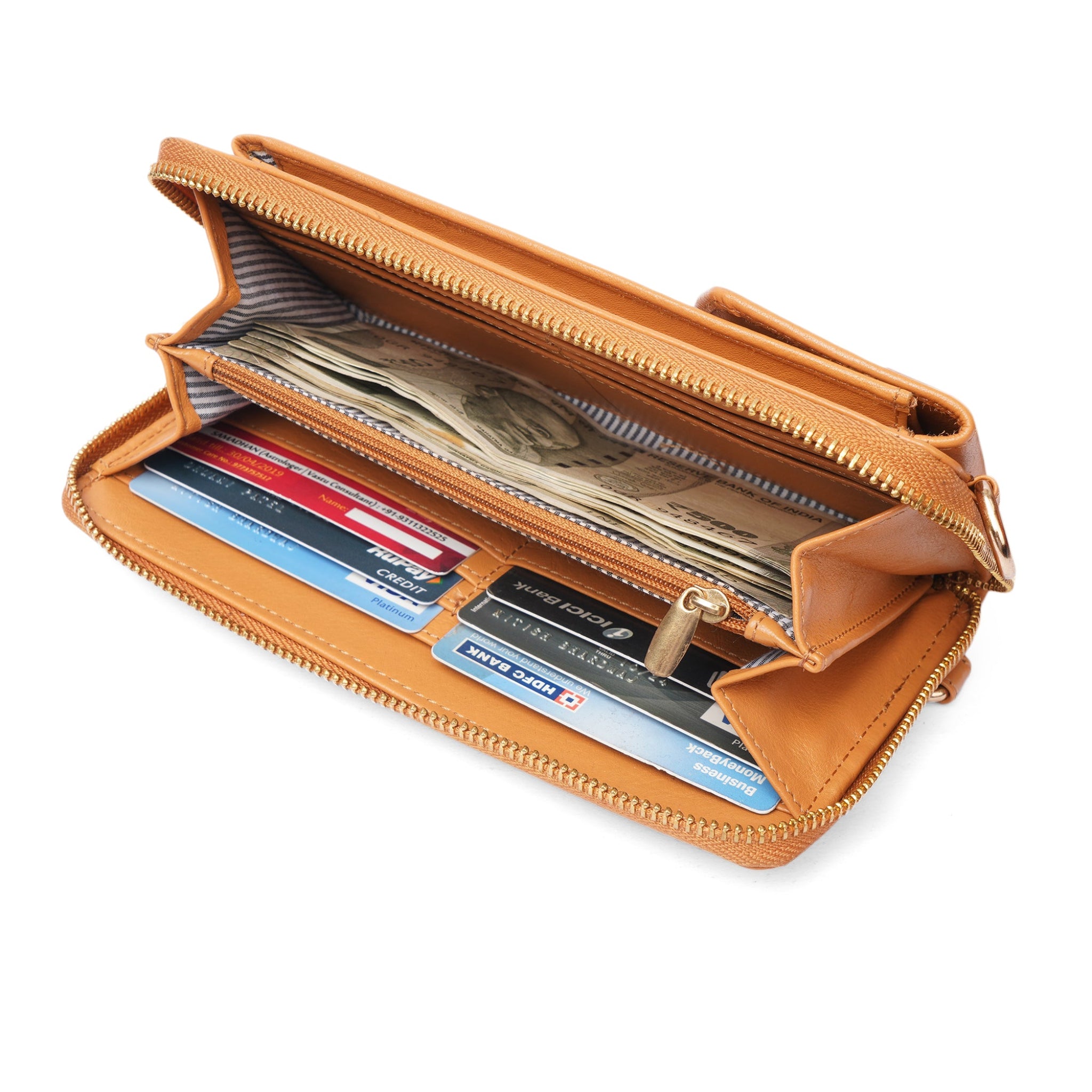 Interior view of the Tan Minori leather wallet crossbody bag showing organized card slots, cash compartment, and zipper pocket.