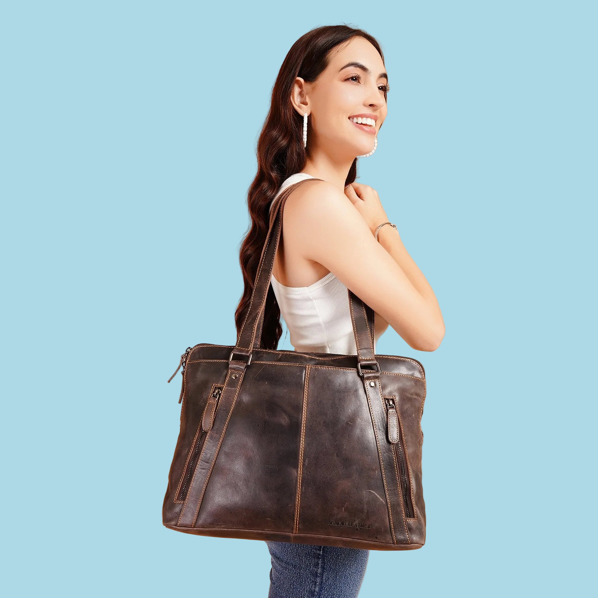 Minori Leather Camille leather laptop tote bag with sturdy handles and spacious interior, ideal for carrying laptops and essentials.