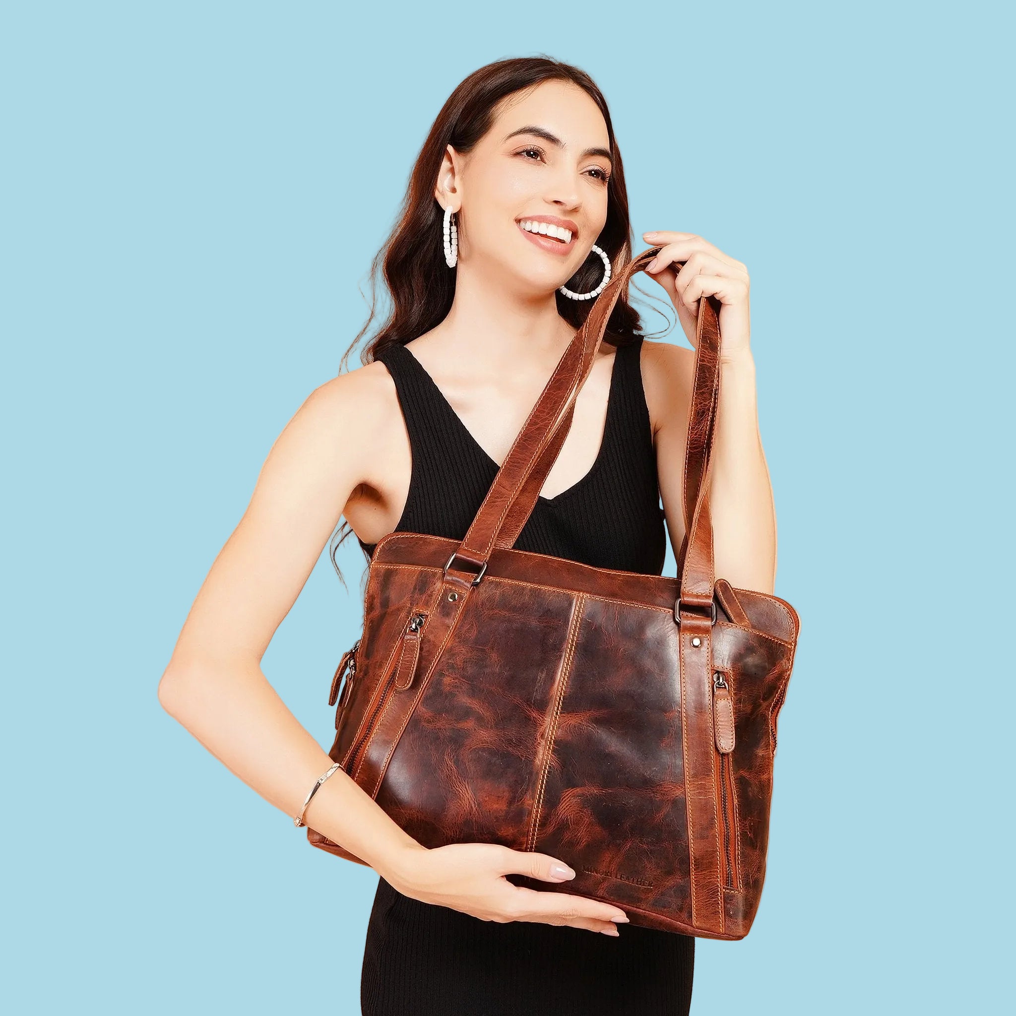 Minori Leather Camille leather laptop tote bag with sturdy handles and sleek design, perfect for professional use.
