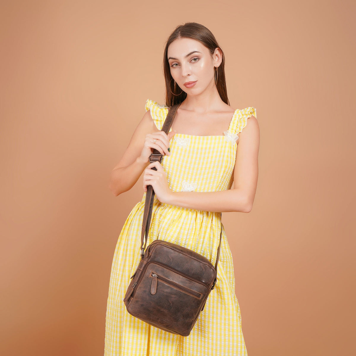 Minori Leather Harbor brown leather crossbody messenger bag with adjustable strap and front pocket, stylish and functional.
