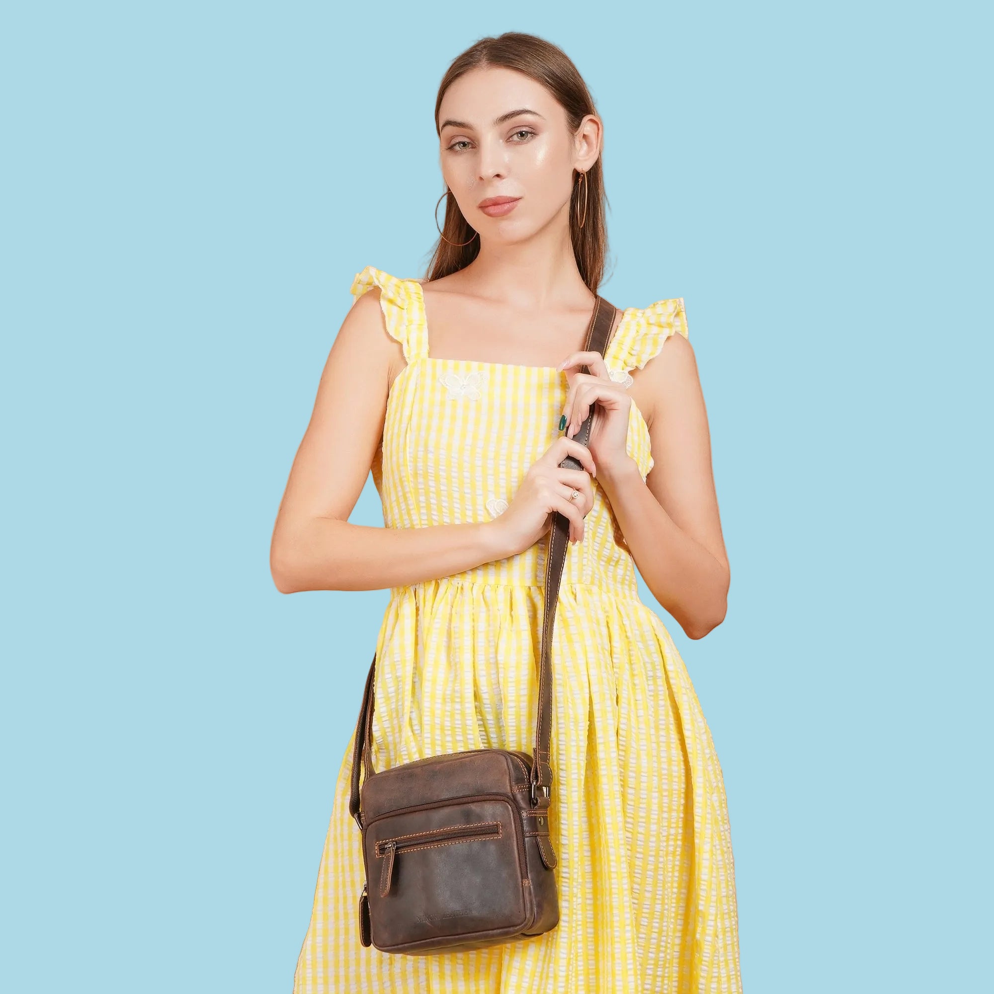 Minori Leather Cove brown leather crossbody bag with adjustable strap and minimalist design, perfect for everyday use.